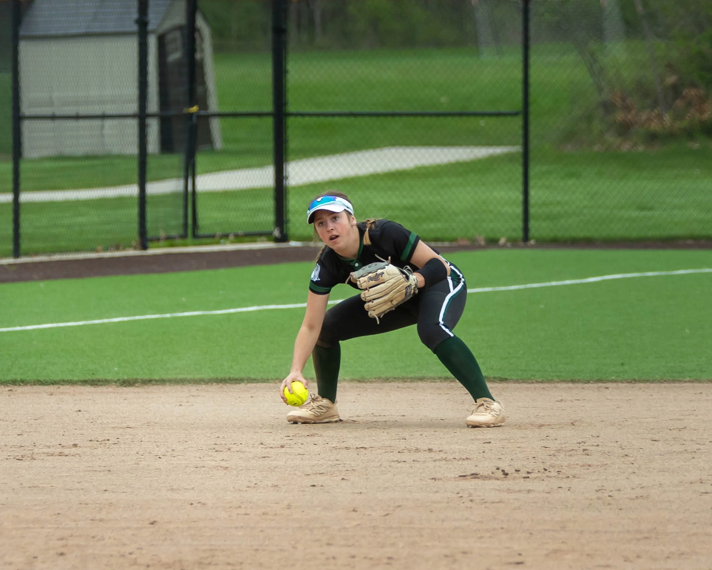 Kettering short stop picks up the ball