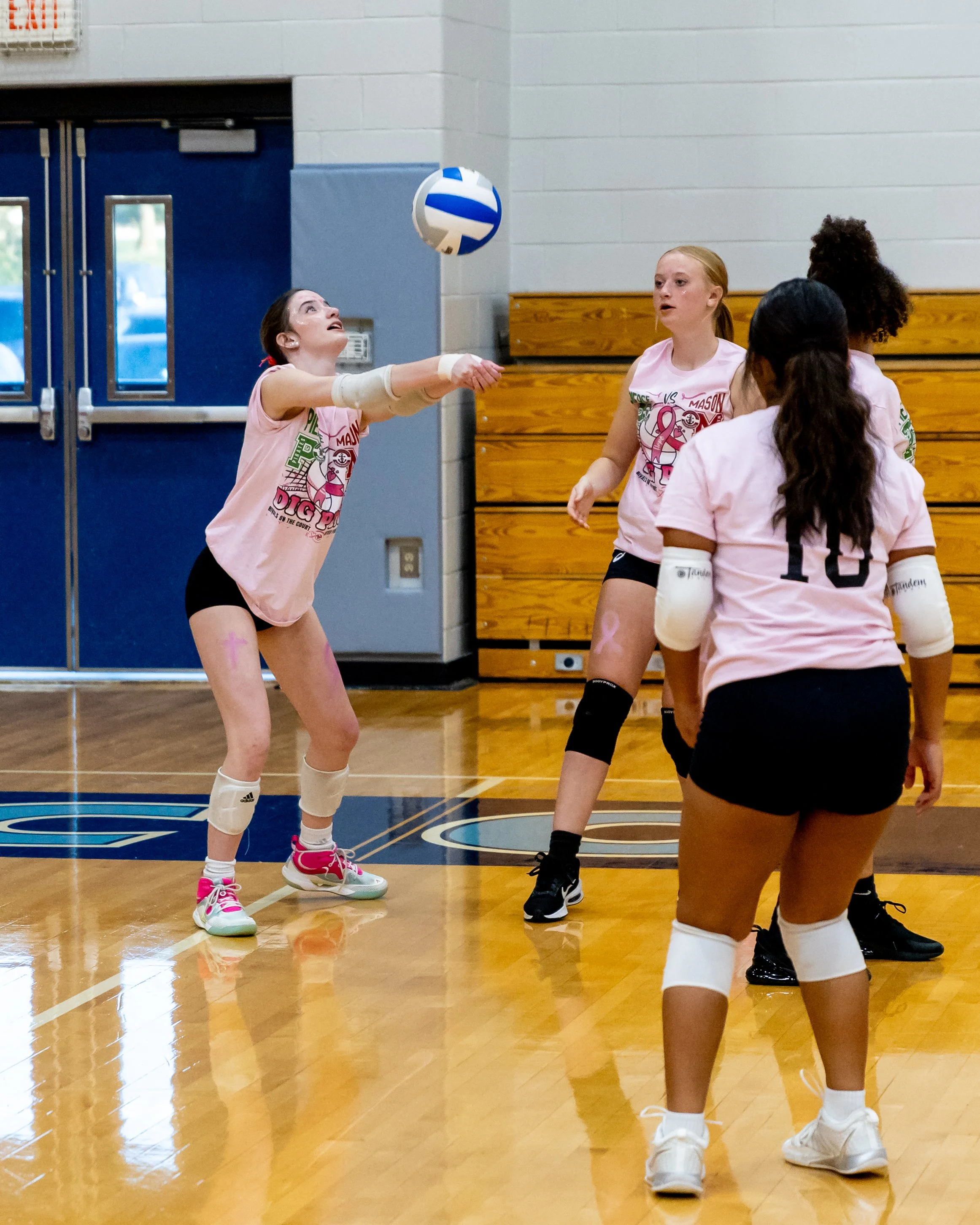 Mason player hits the ball