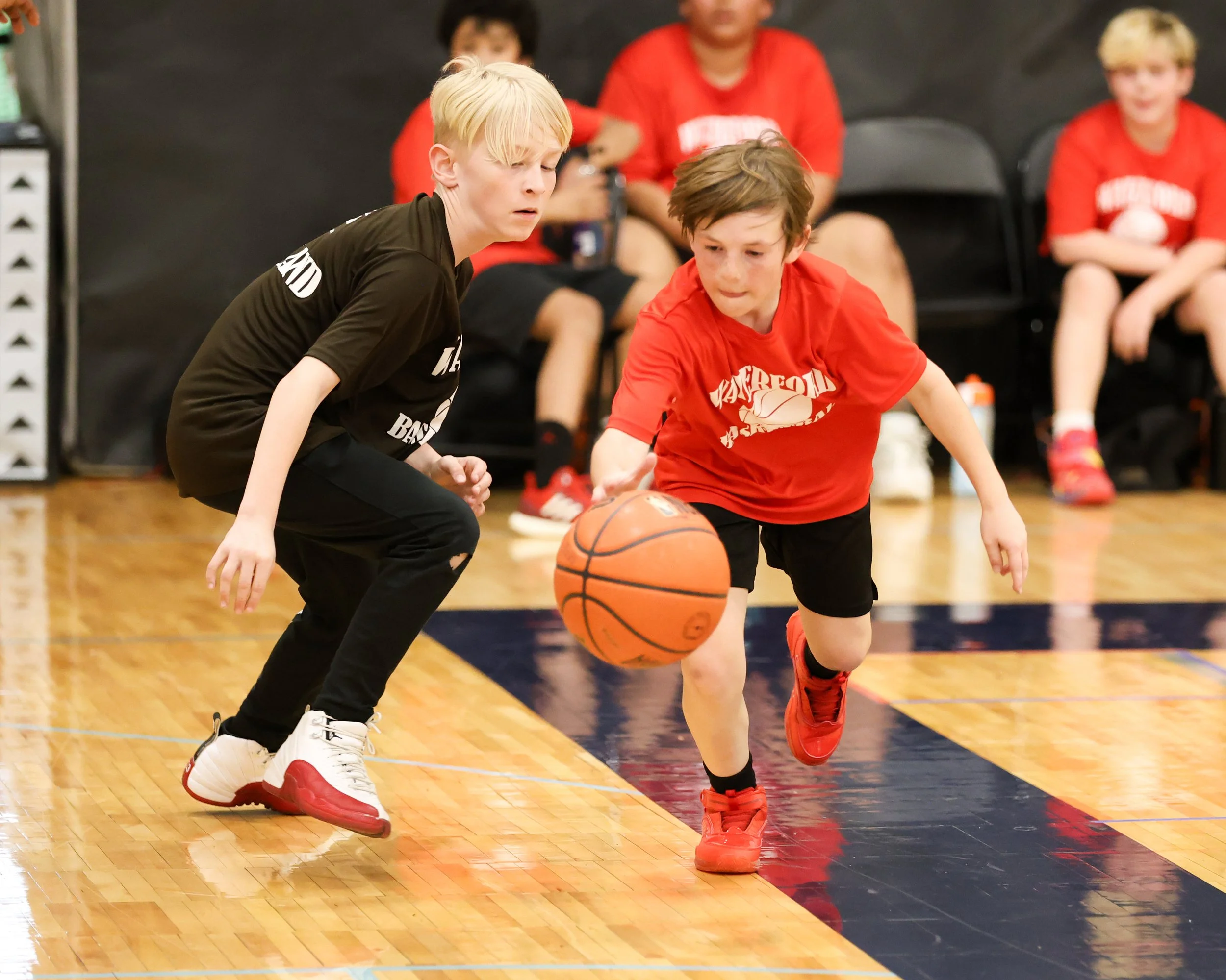 Houghton boy dribbles the ball past Haviland boy