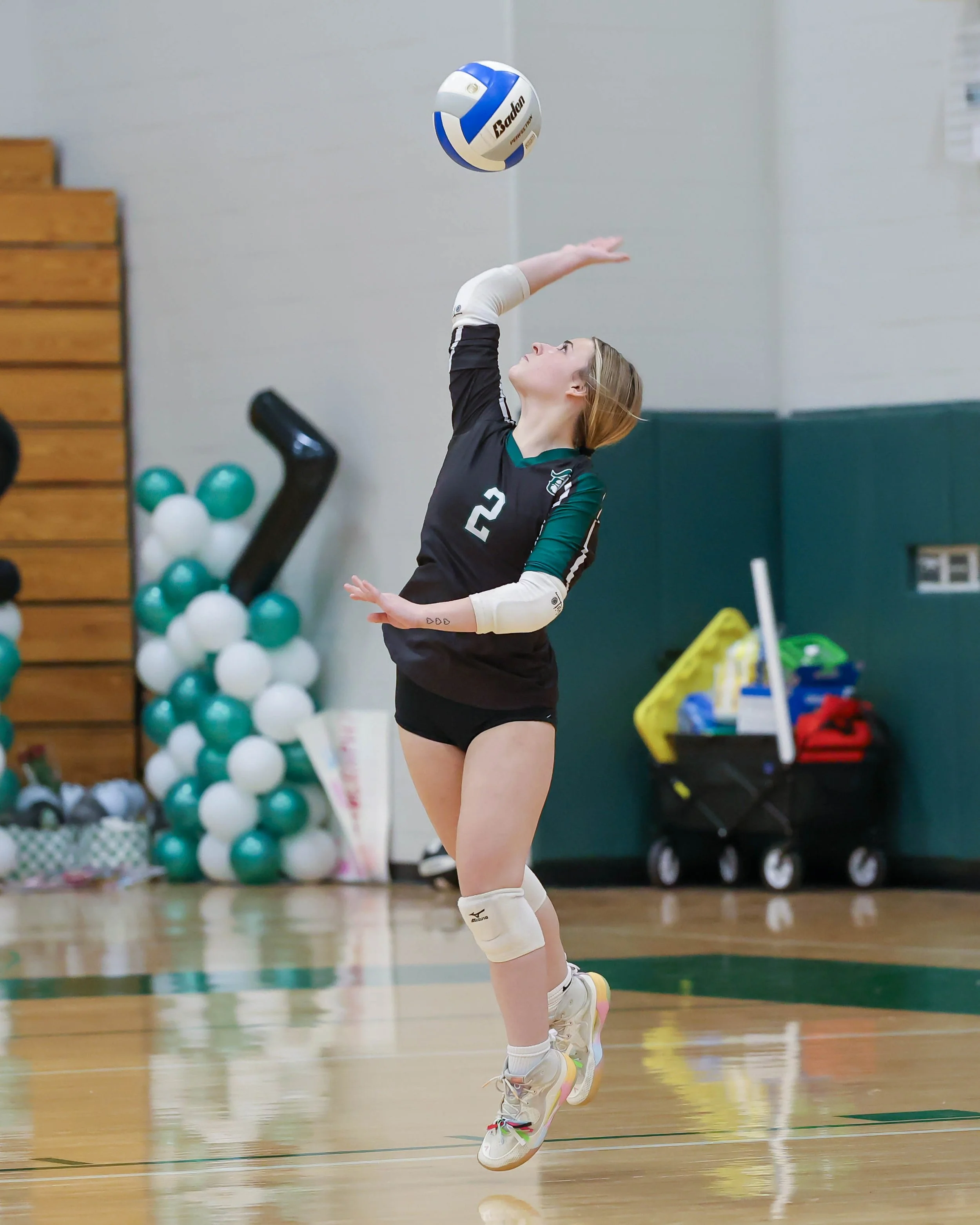 Kettering #2 serves the ball