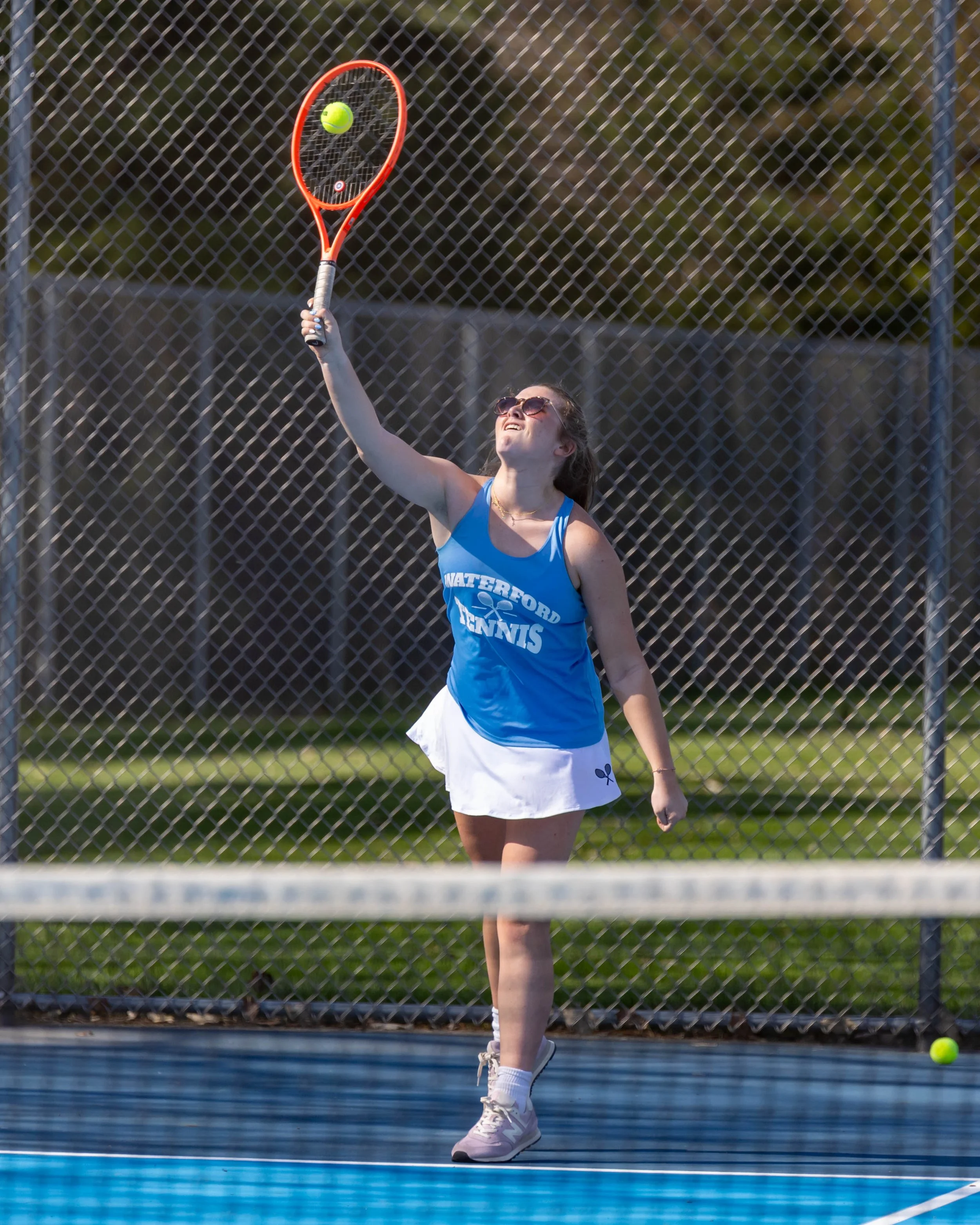 Waterford United player serves the ball