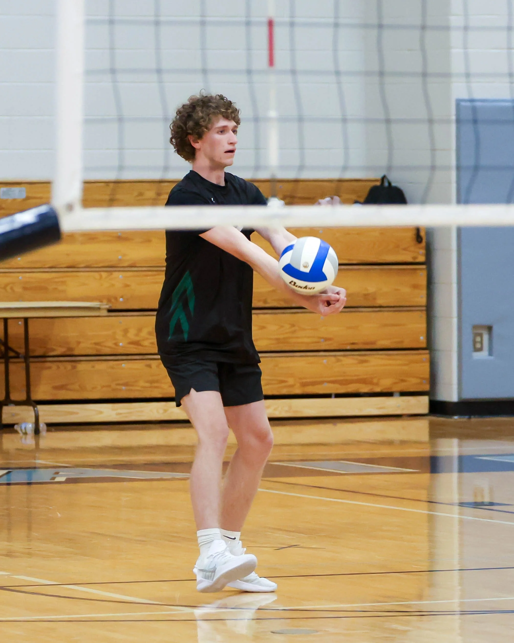 Kettering #12 serves the ball