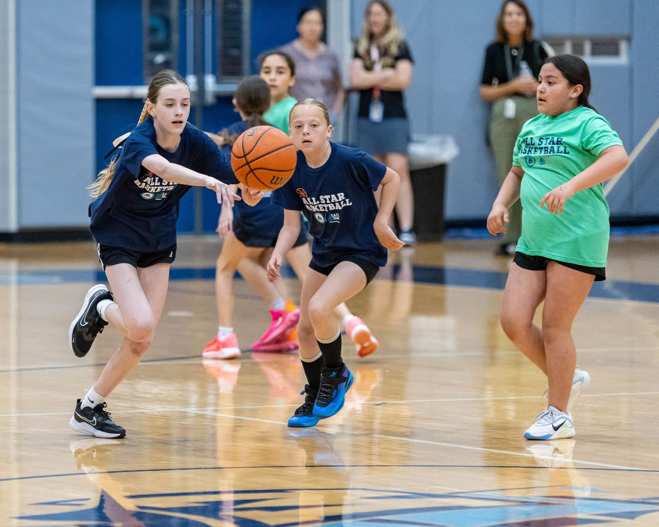 North girl dribbles the ball