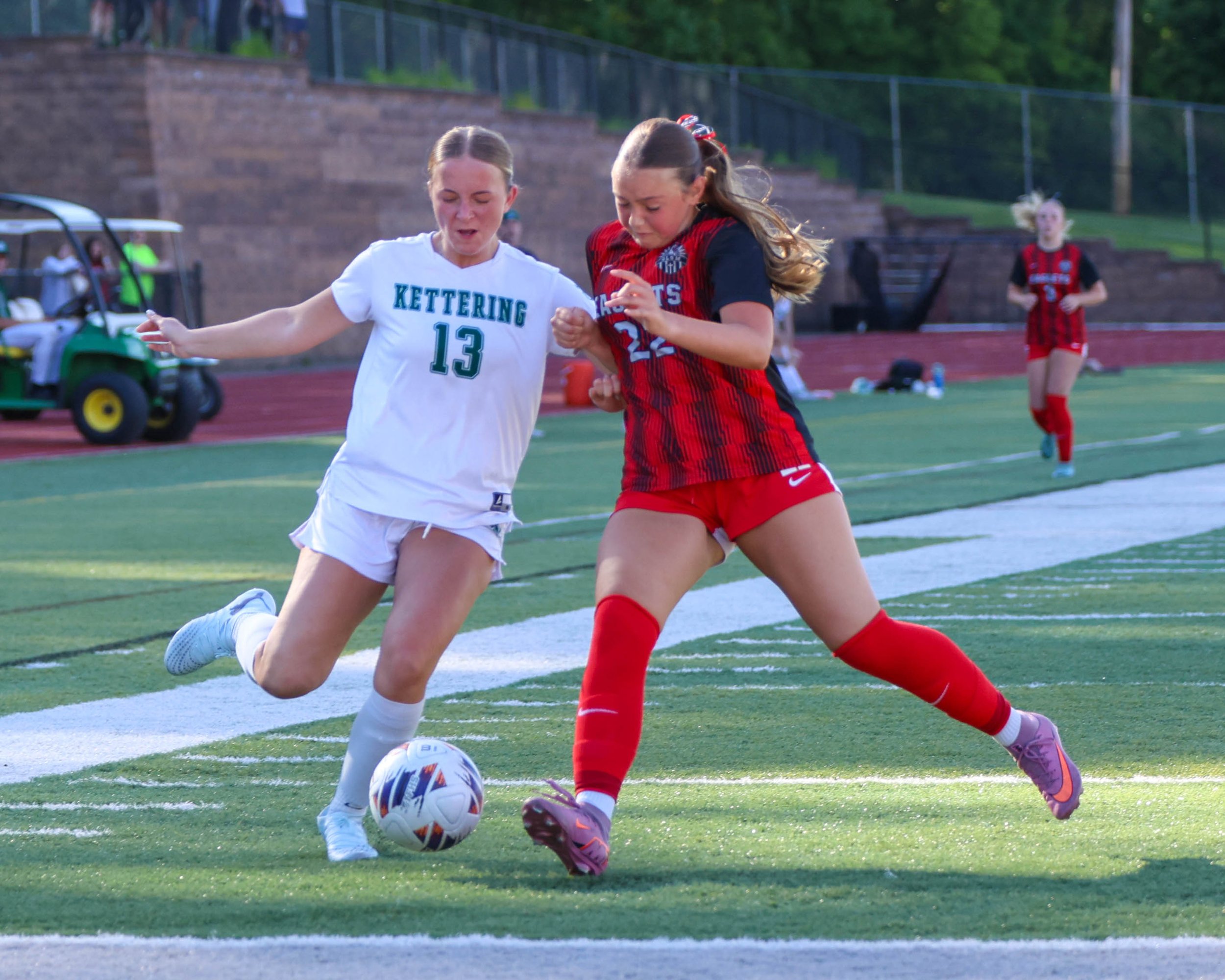 #13 kicks the ball
