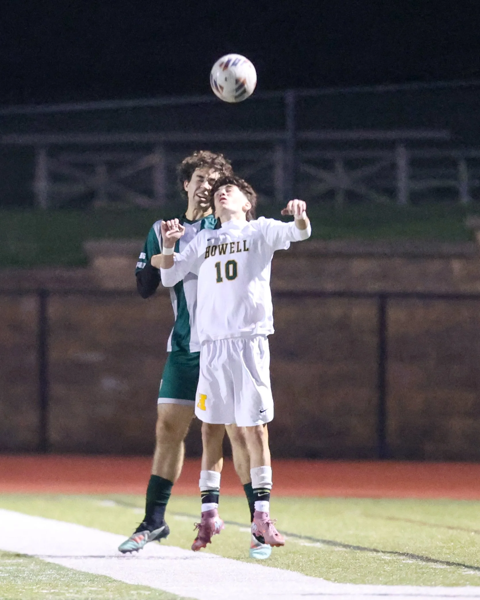 WK #2 heads the ball