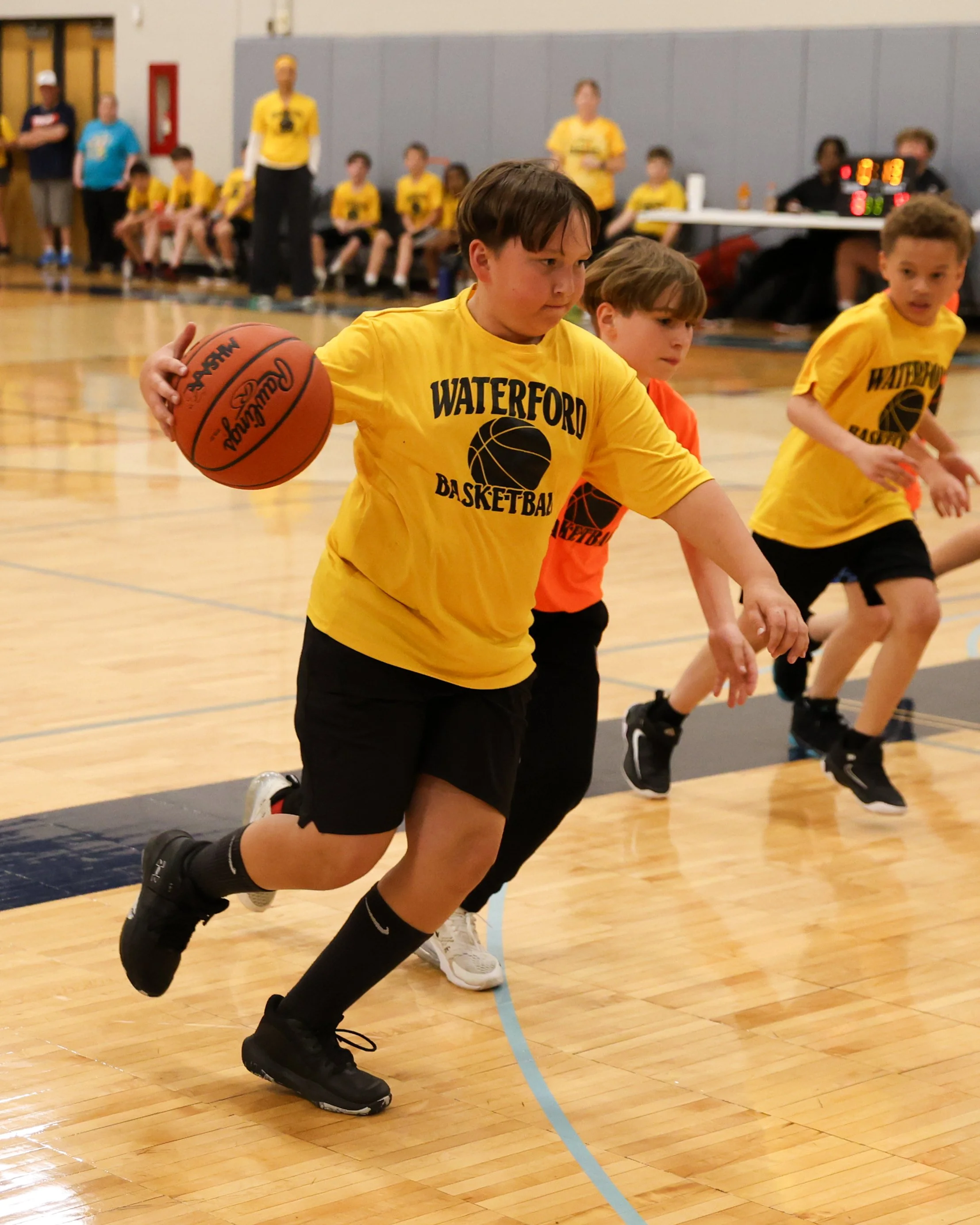 Schoolcraft boy cribbing the ball