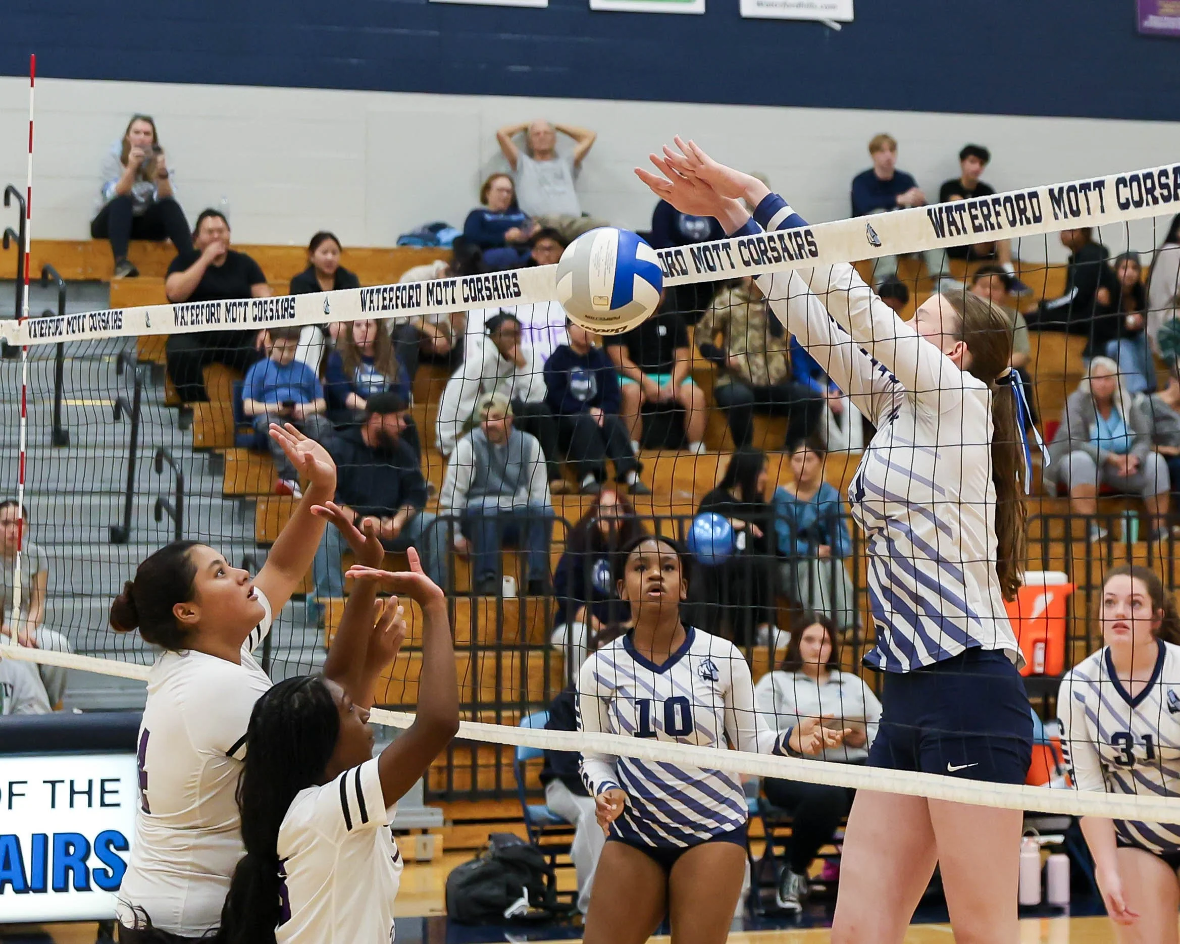 Mott #11 blocks the ball