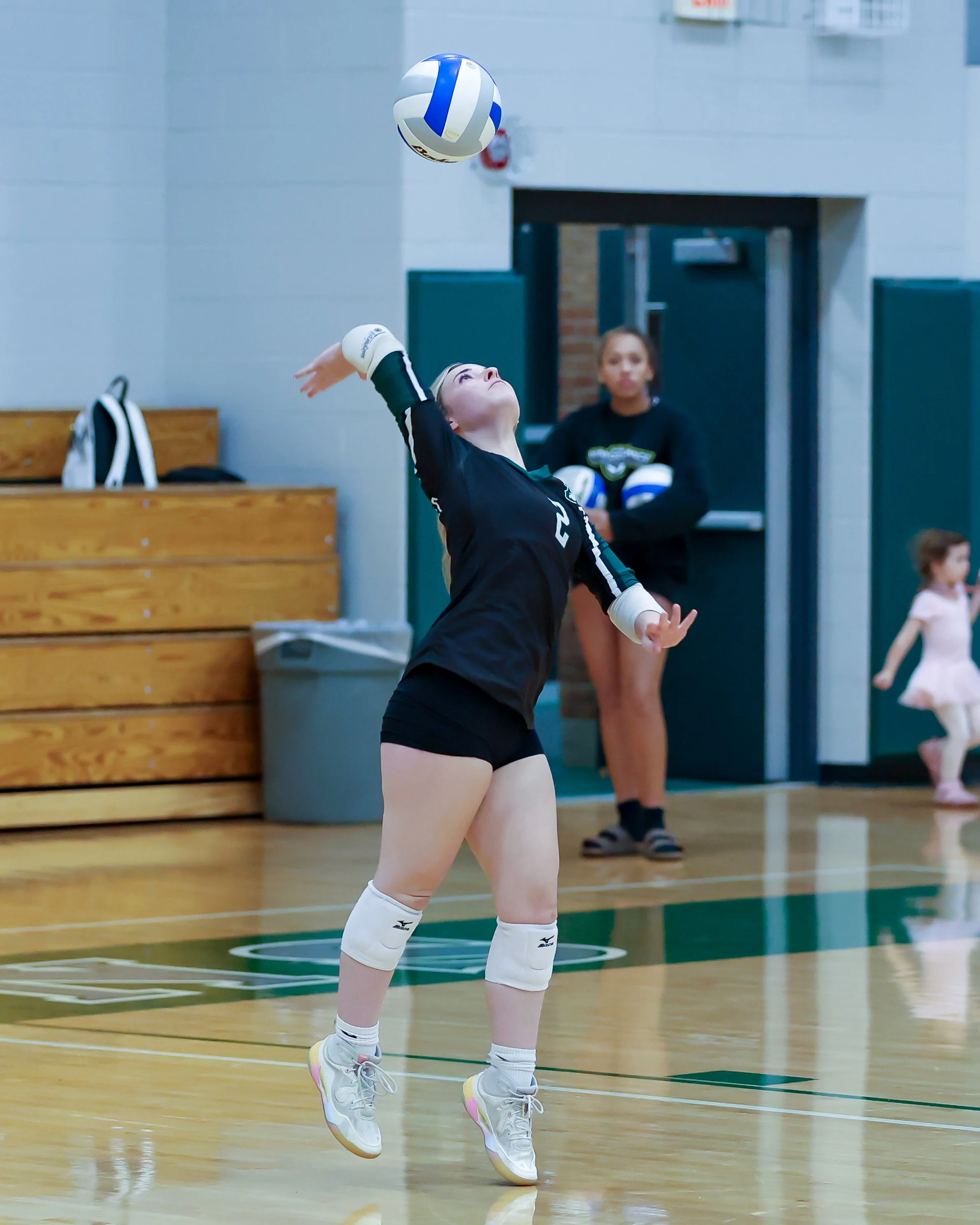 WK #2 serves the ball