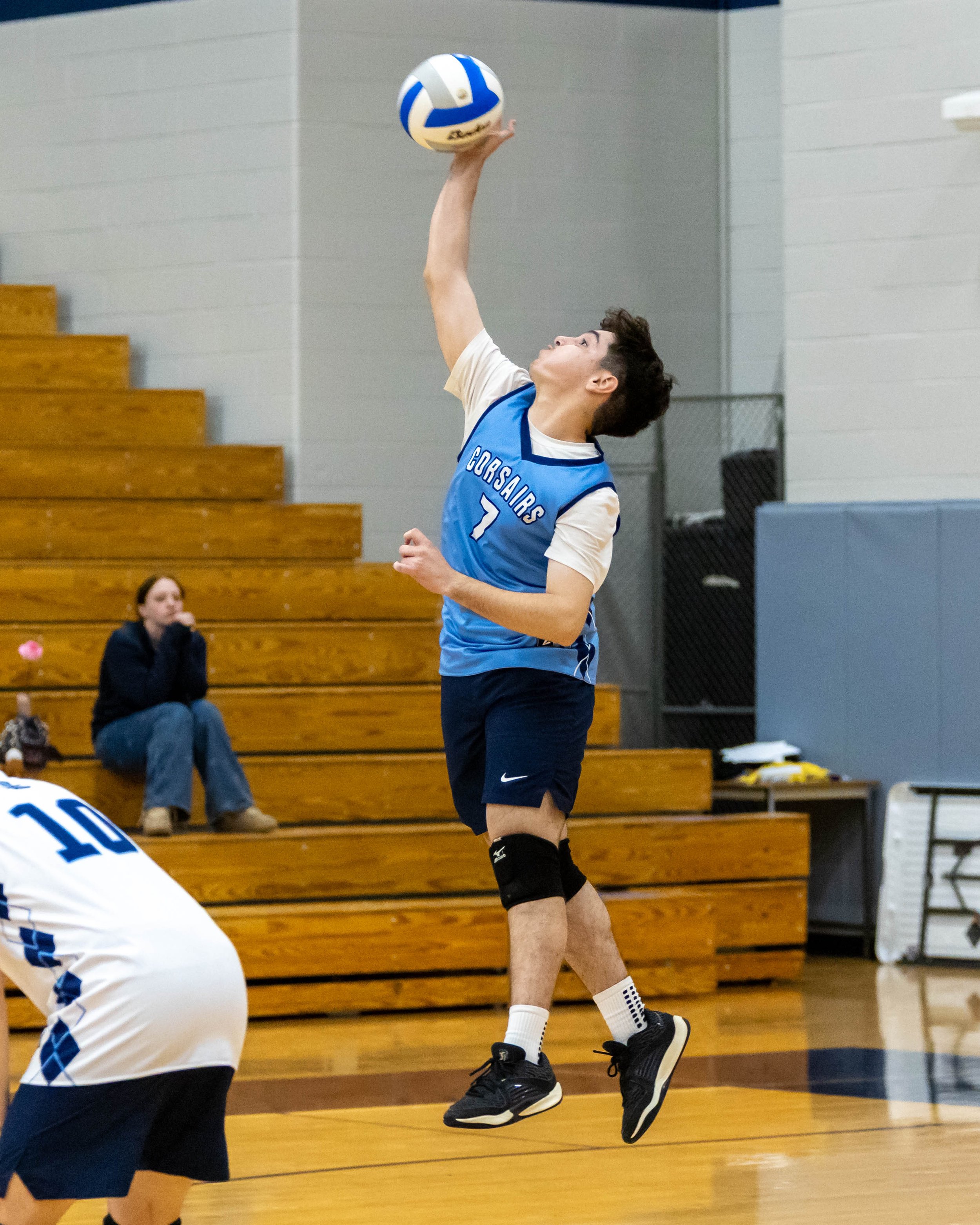 #7 serves the ball