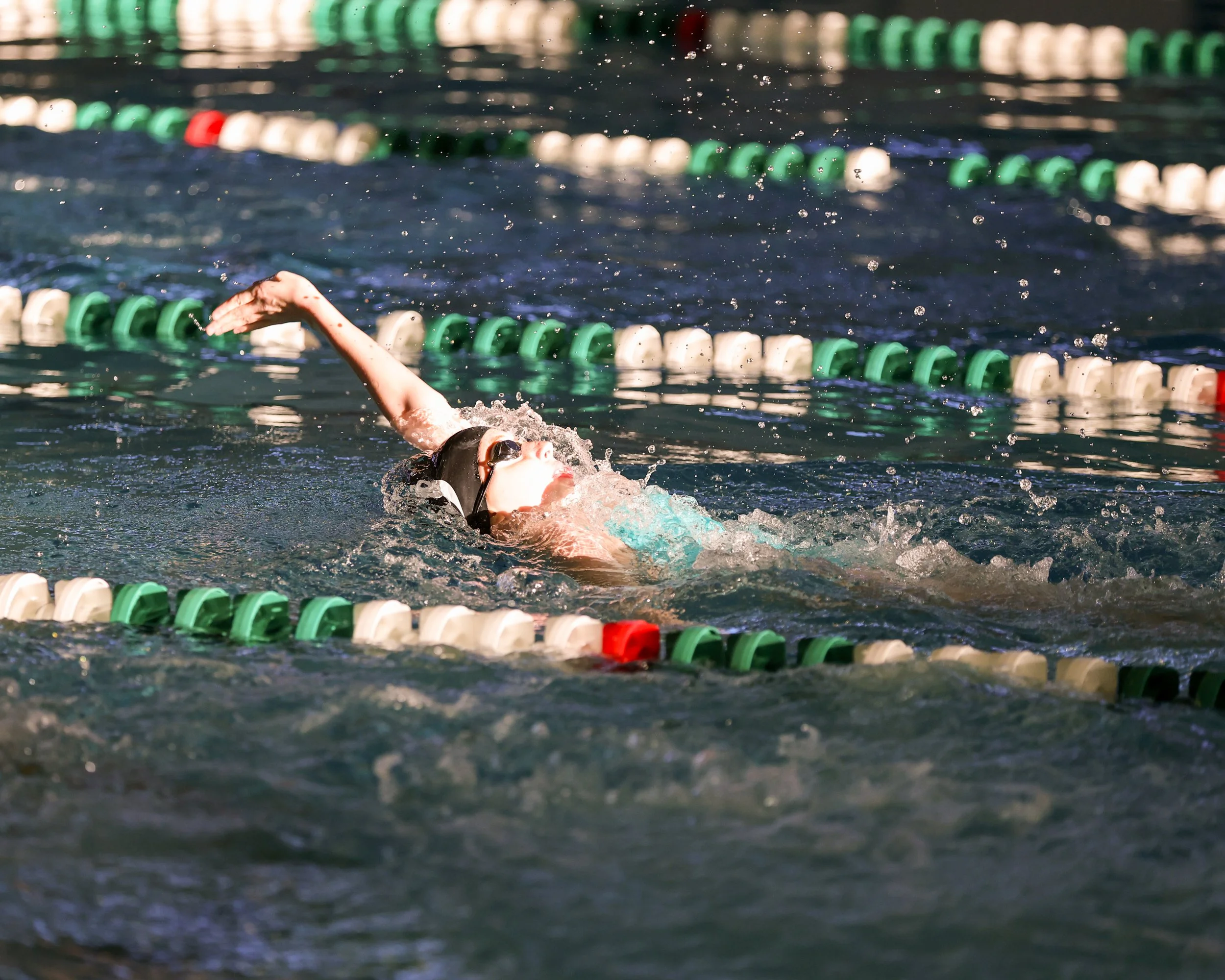 WU swimmer doing backstroke