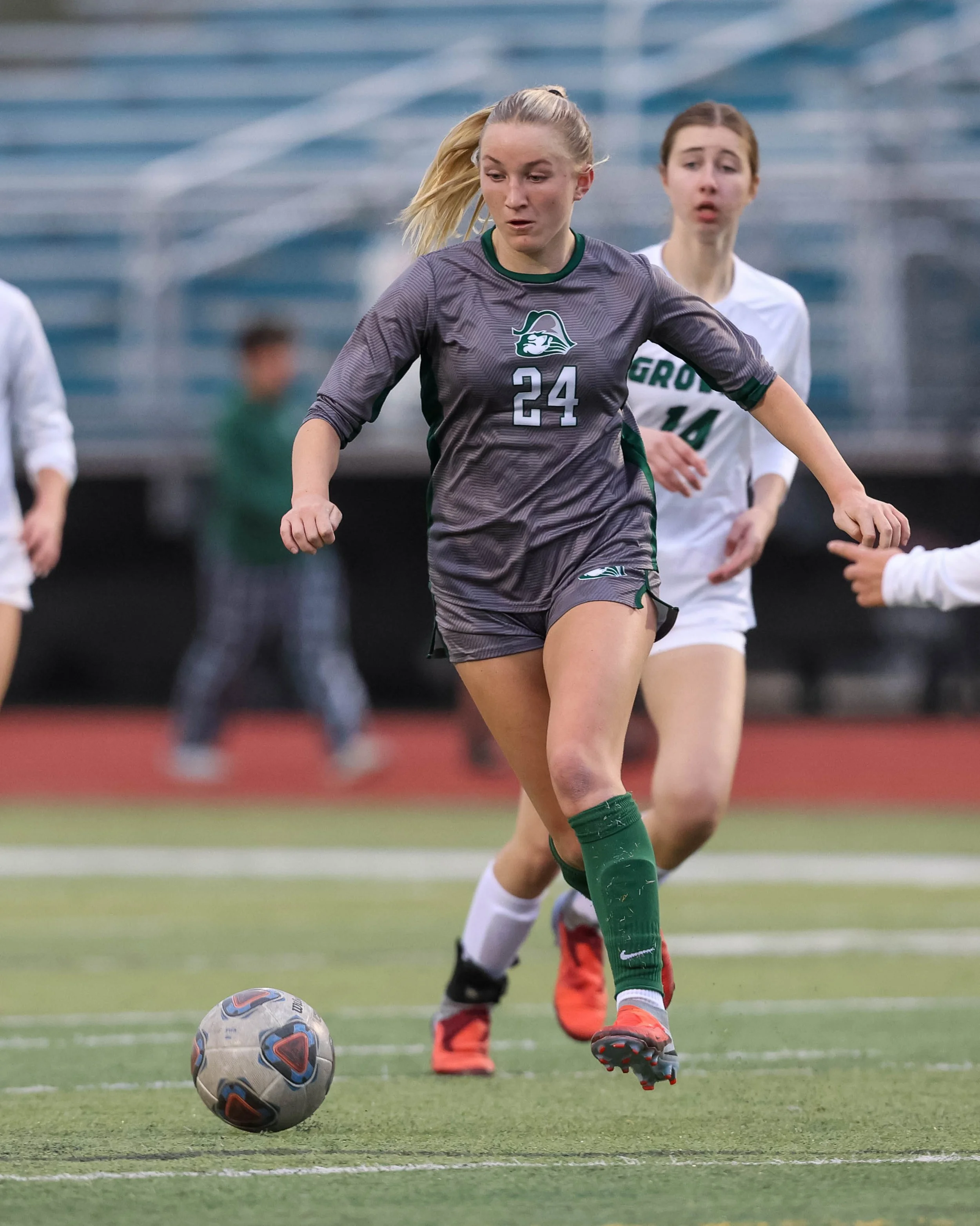 #24 kicks the ball