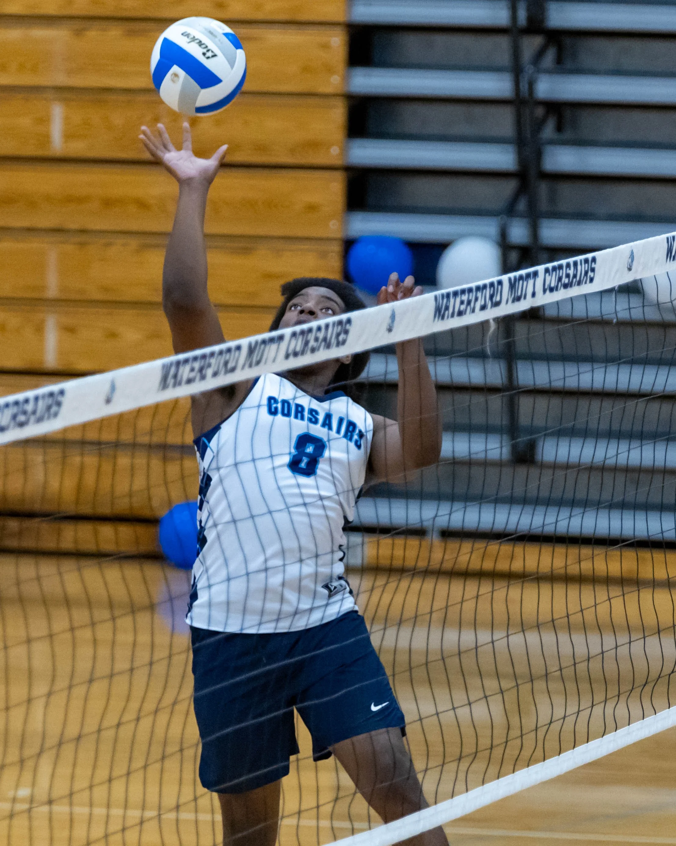 #8 hits the ball over the net