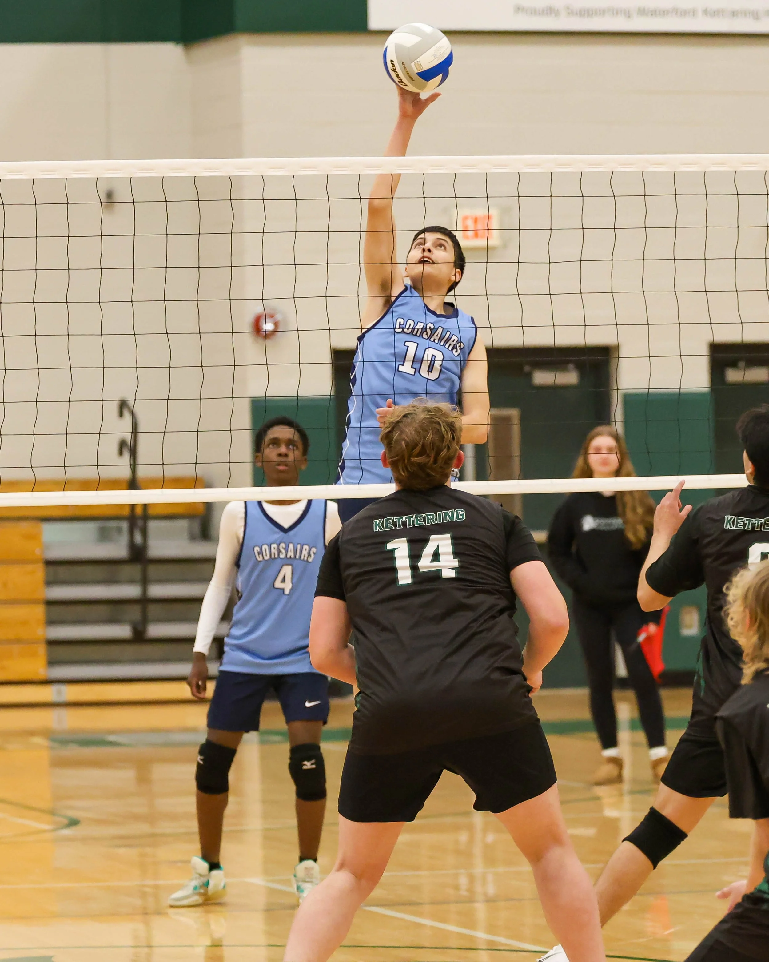 Mott #10 hits the ball over the net