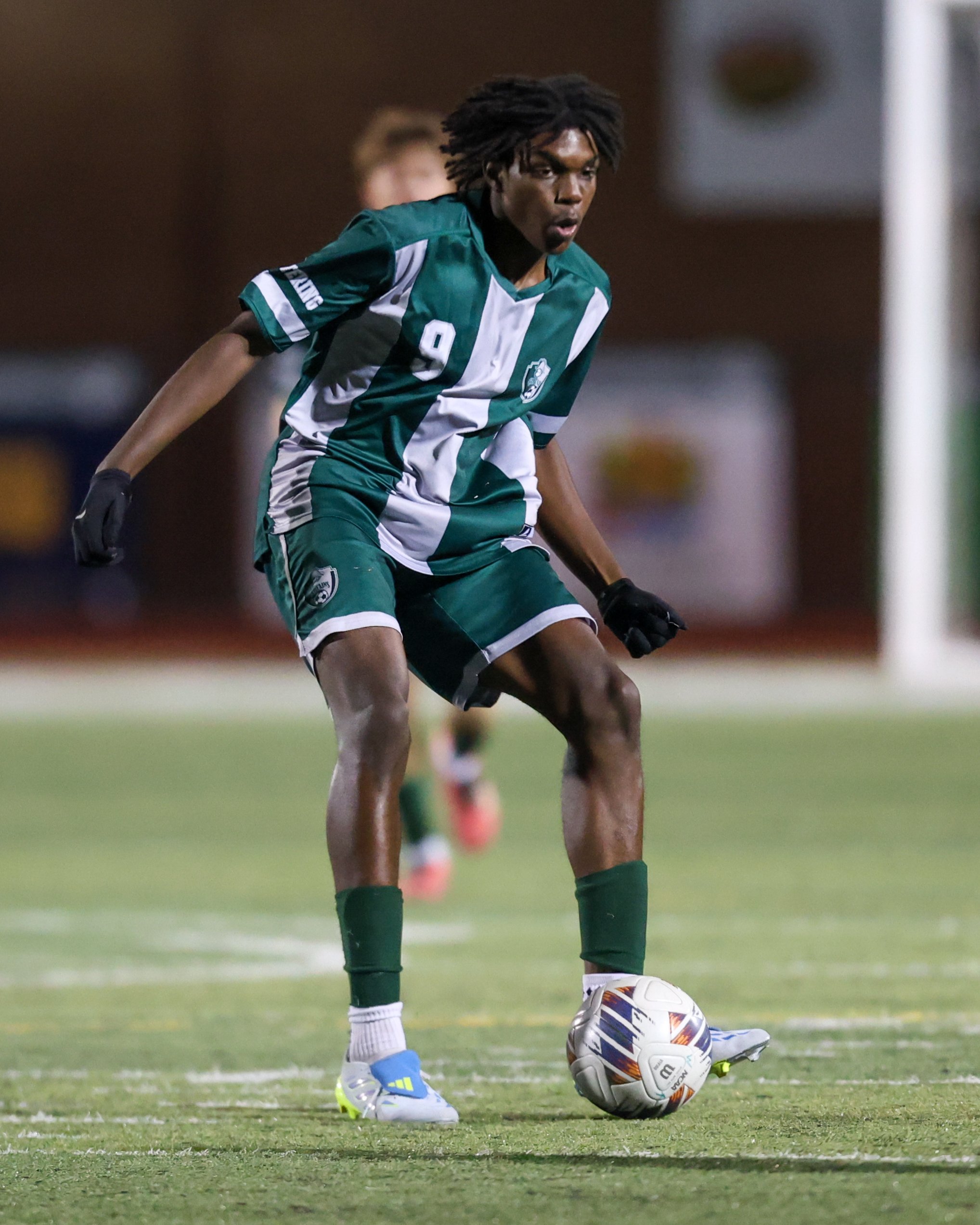 WK #9 kicks the ball