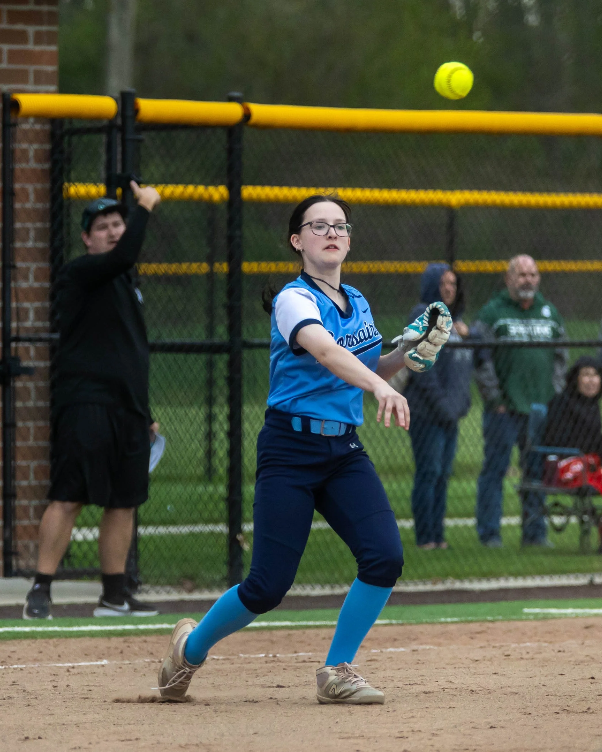 Mott third base throws the ball to first
