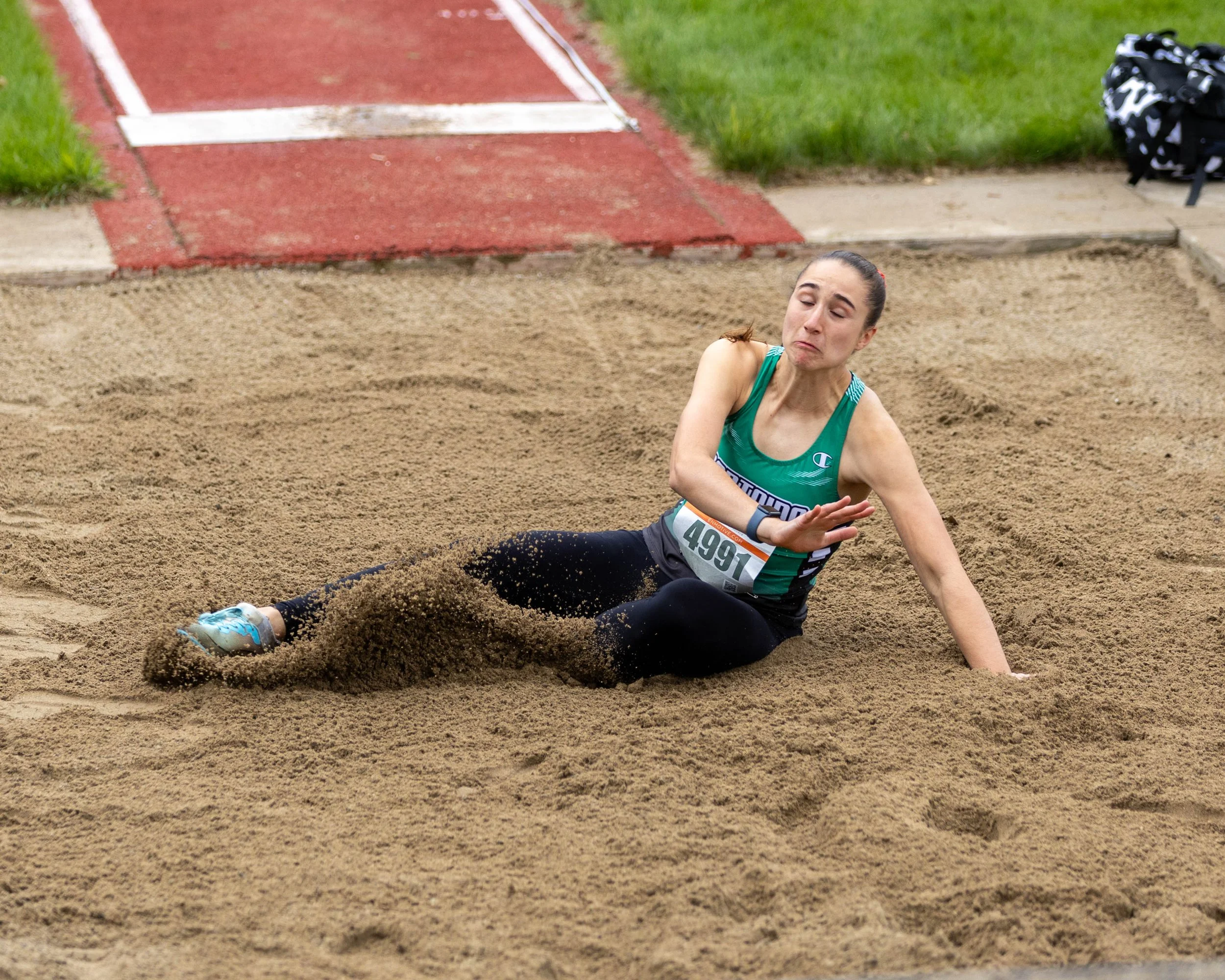 Kettering #4991 landing in the long jump pit