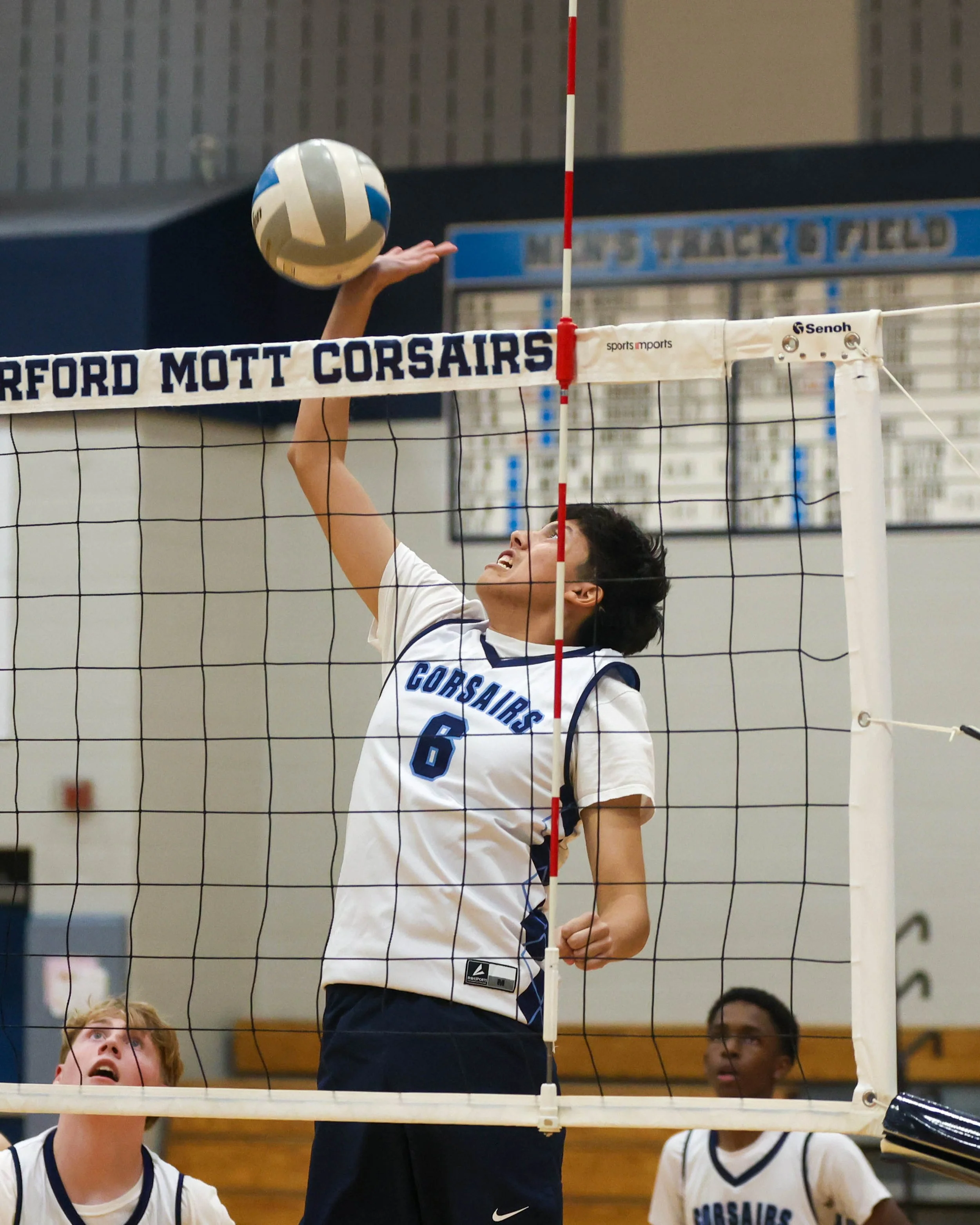 Mott #6 spikes the ball