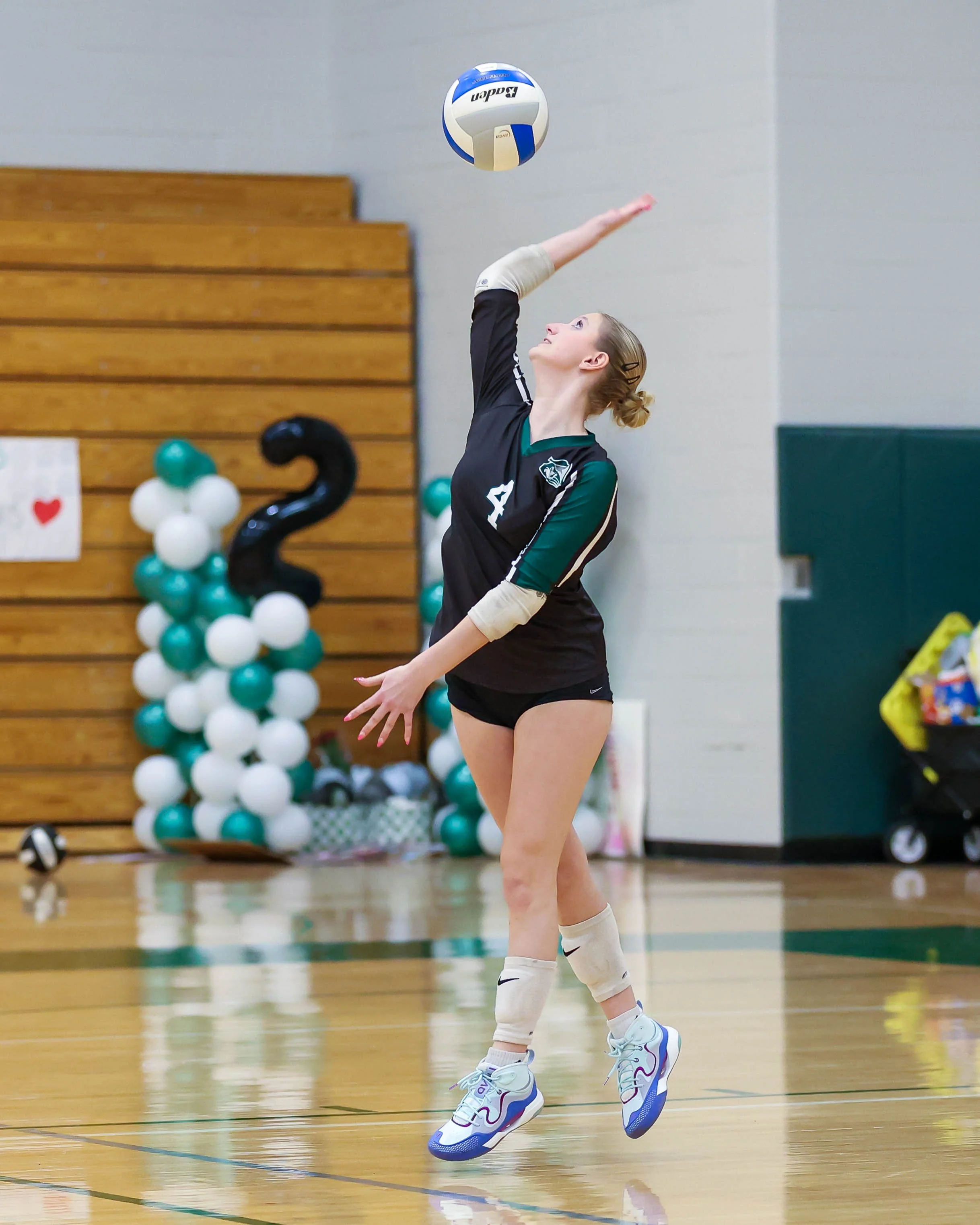 Kettering #4 serves the ball