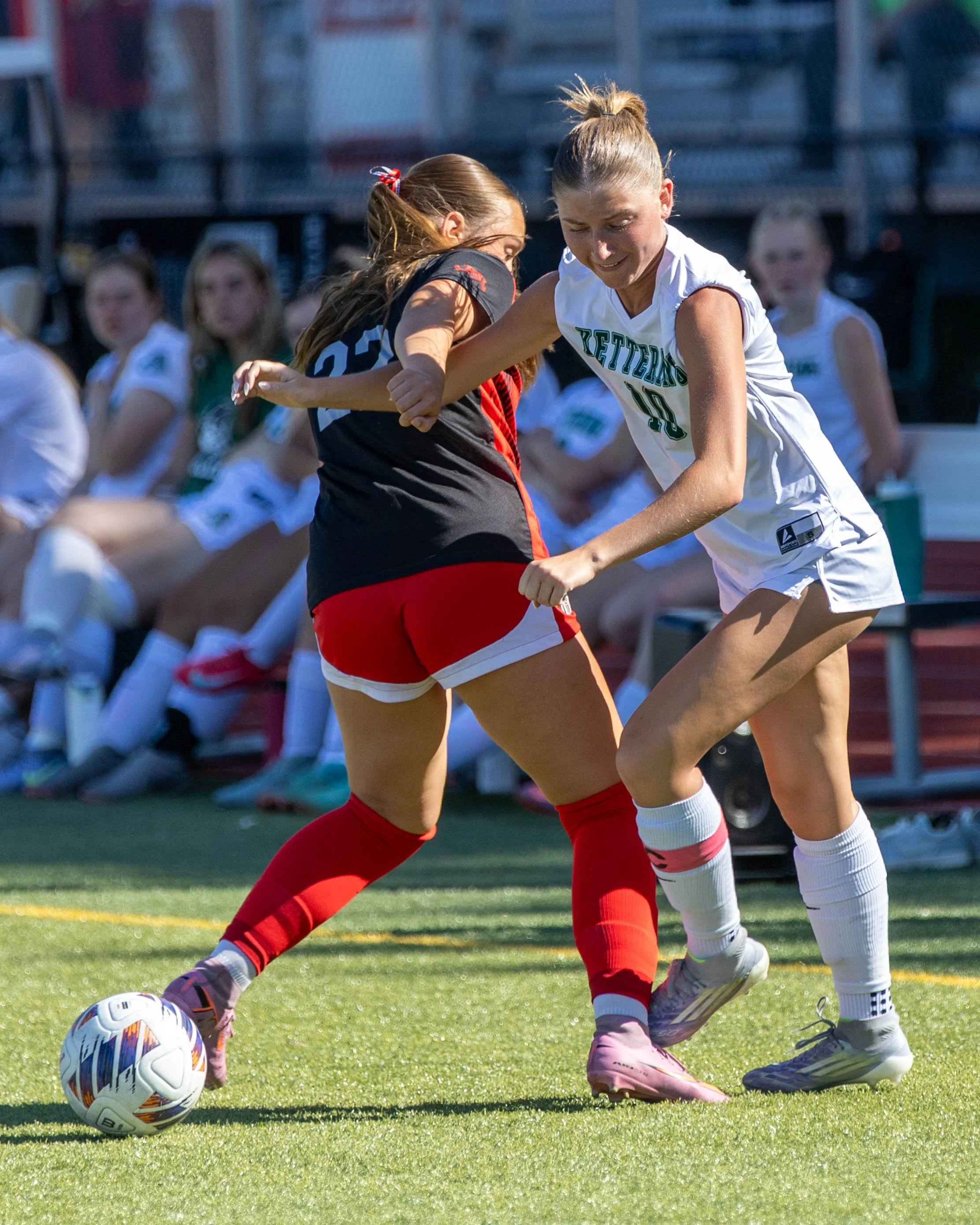 #10 gets the ball around an opponent