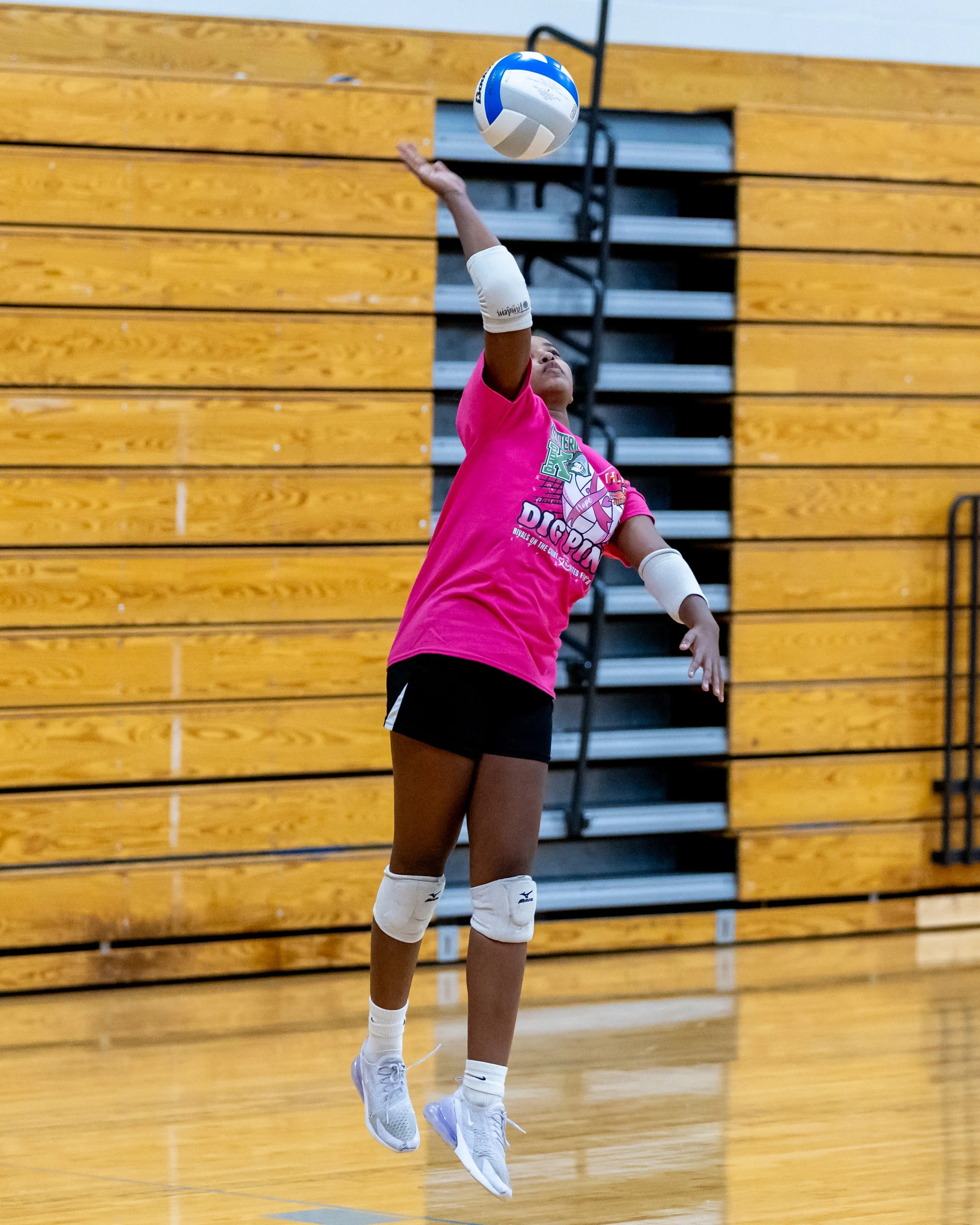 Firebird player serves the ball