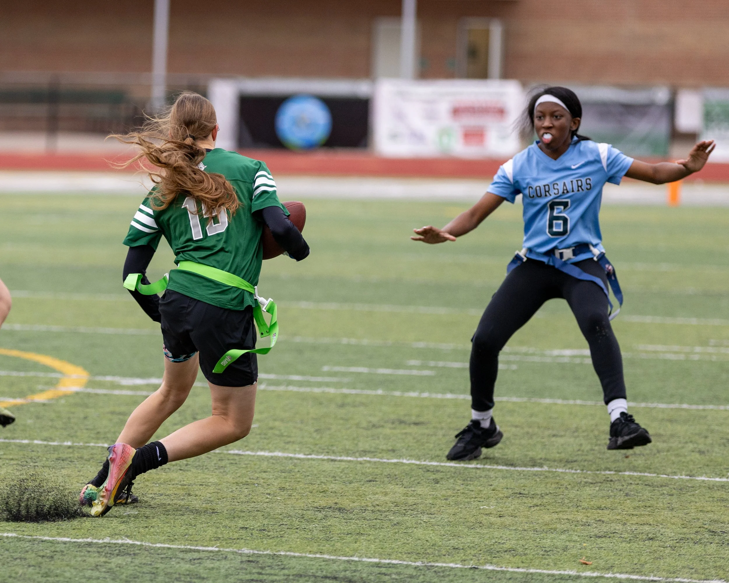 WK #15 runs with the ball towards WM #6