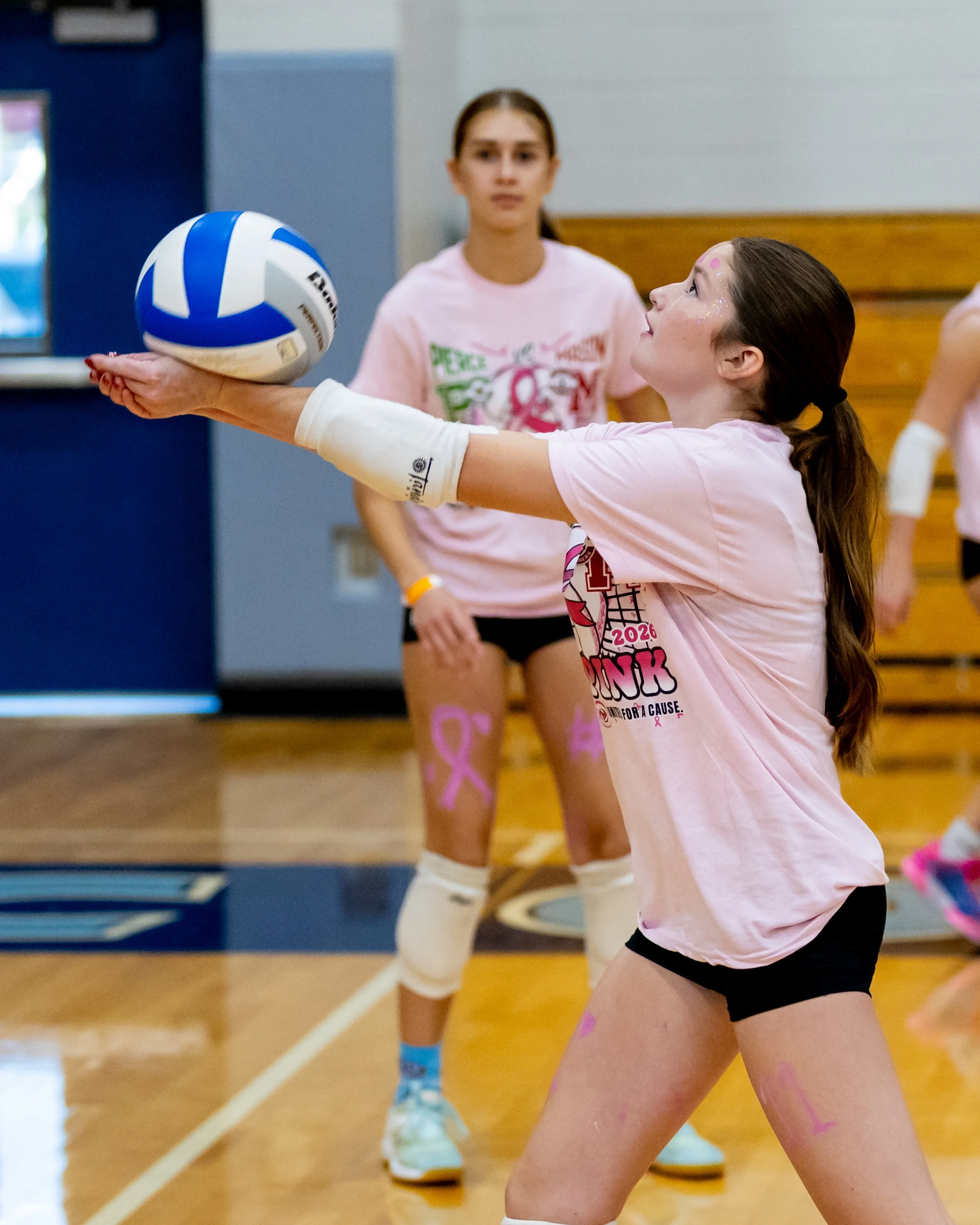 Mason player hits the ball