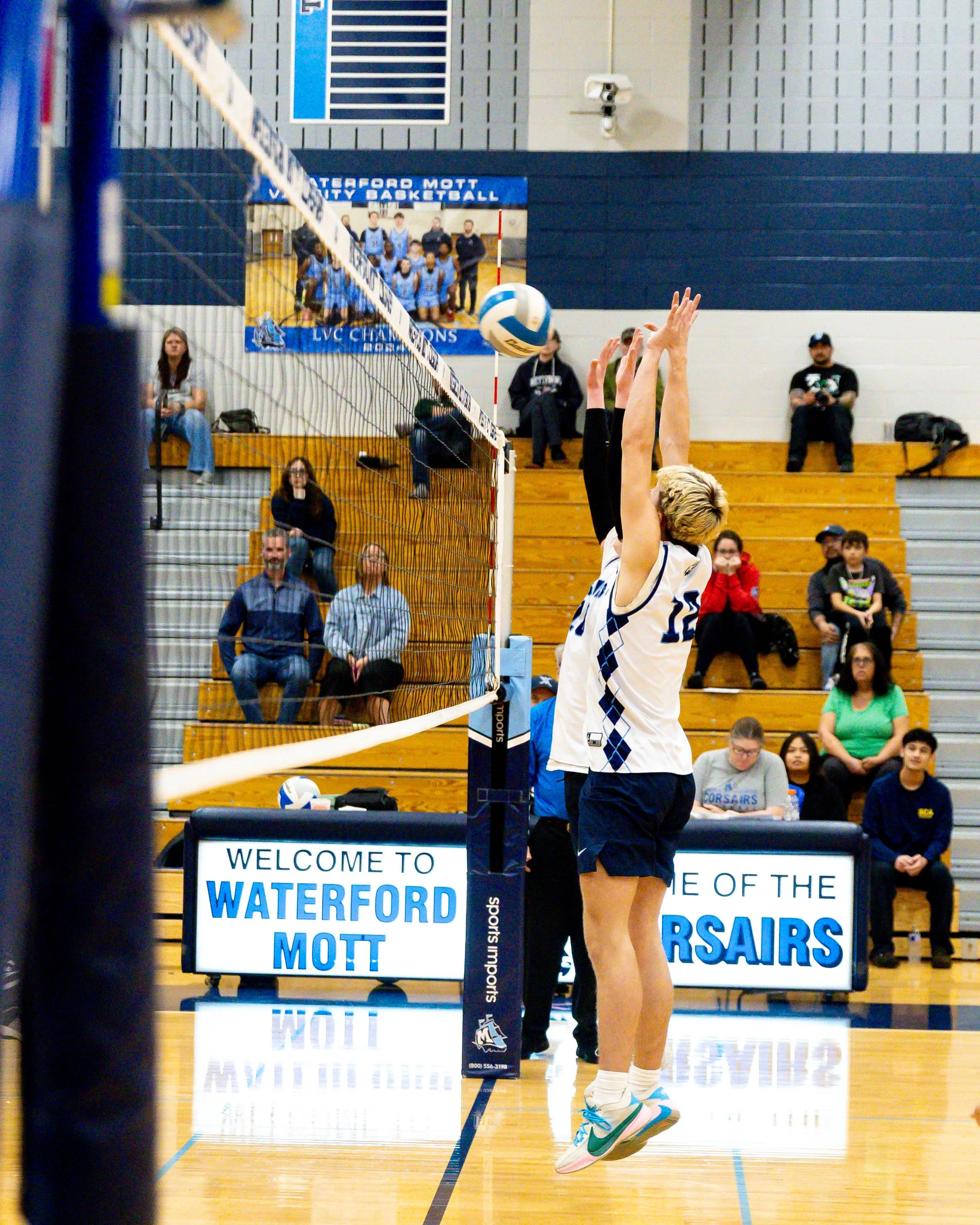 Mott #12 blocks the ball