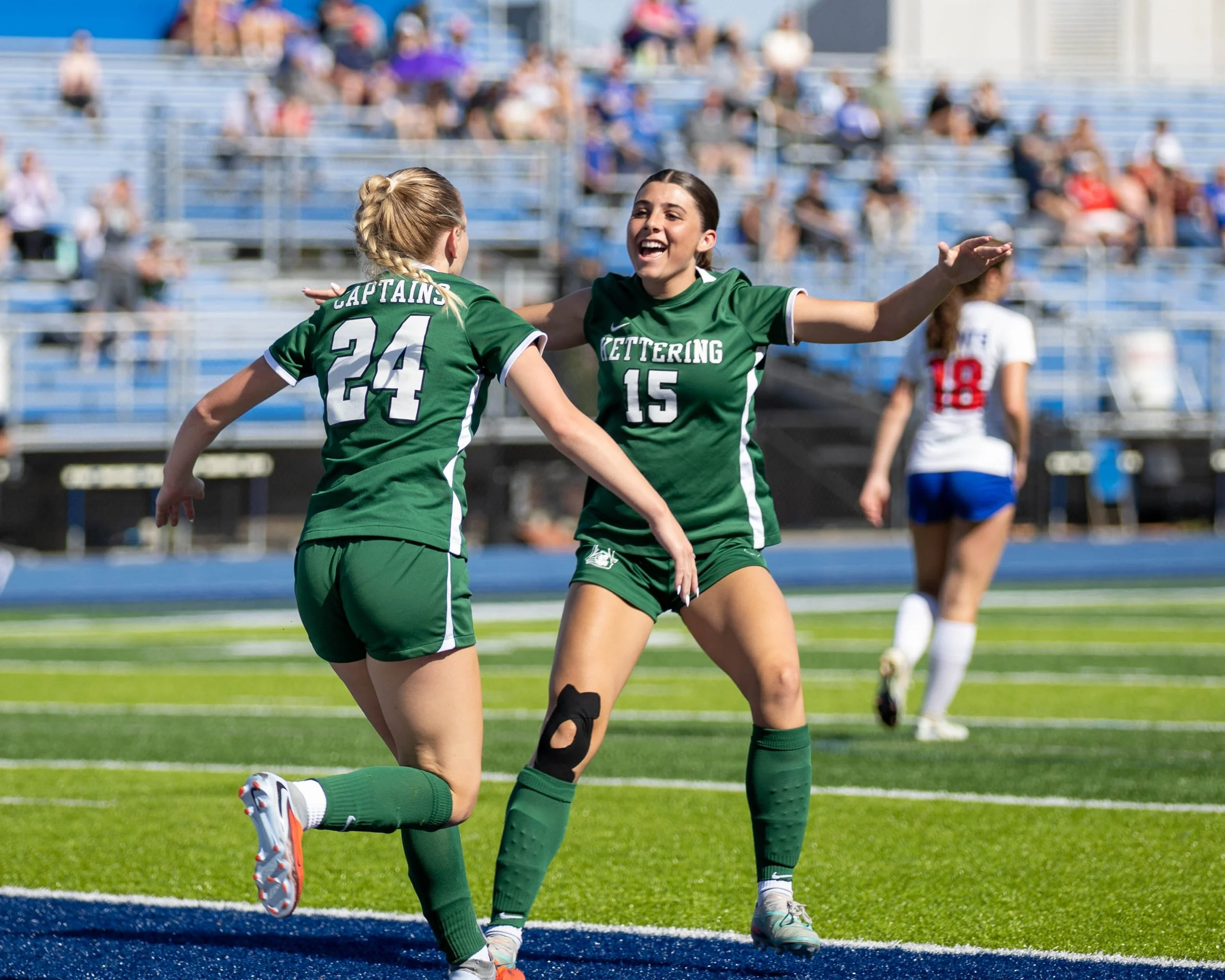 #24 celebrates the goal with #15