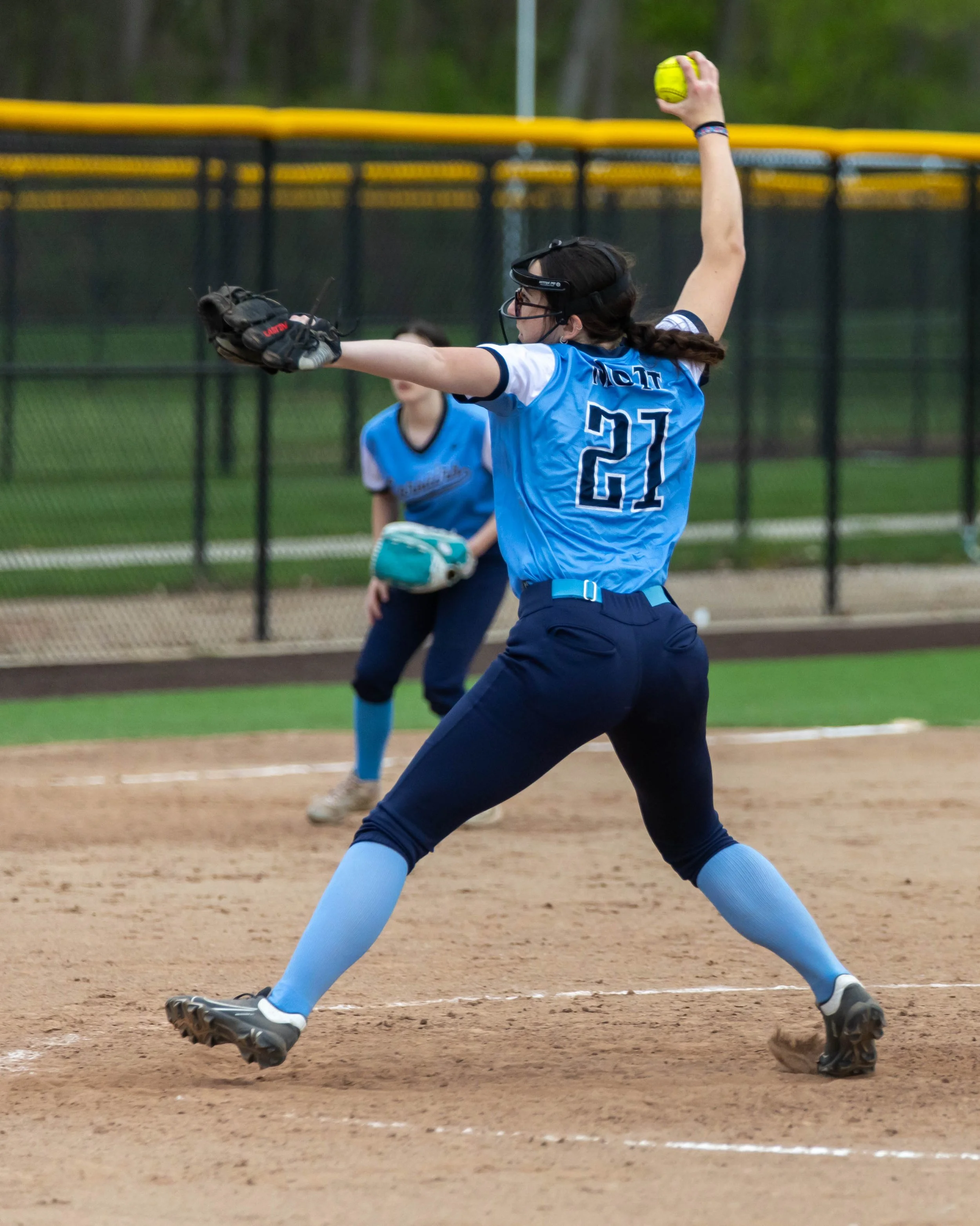 Mott #21 pitches the ball