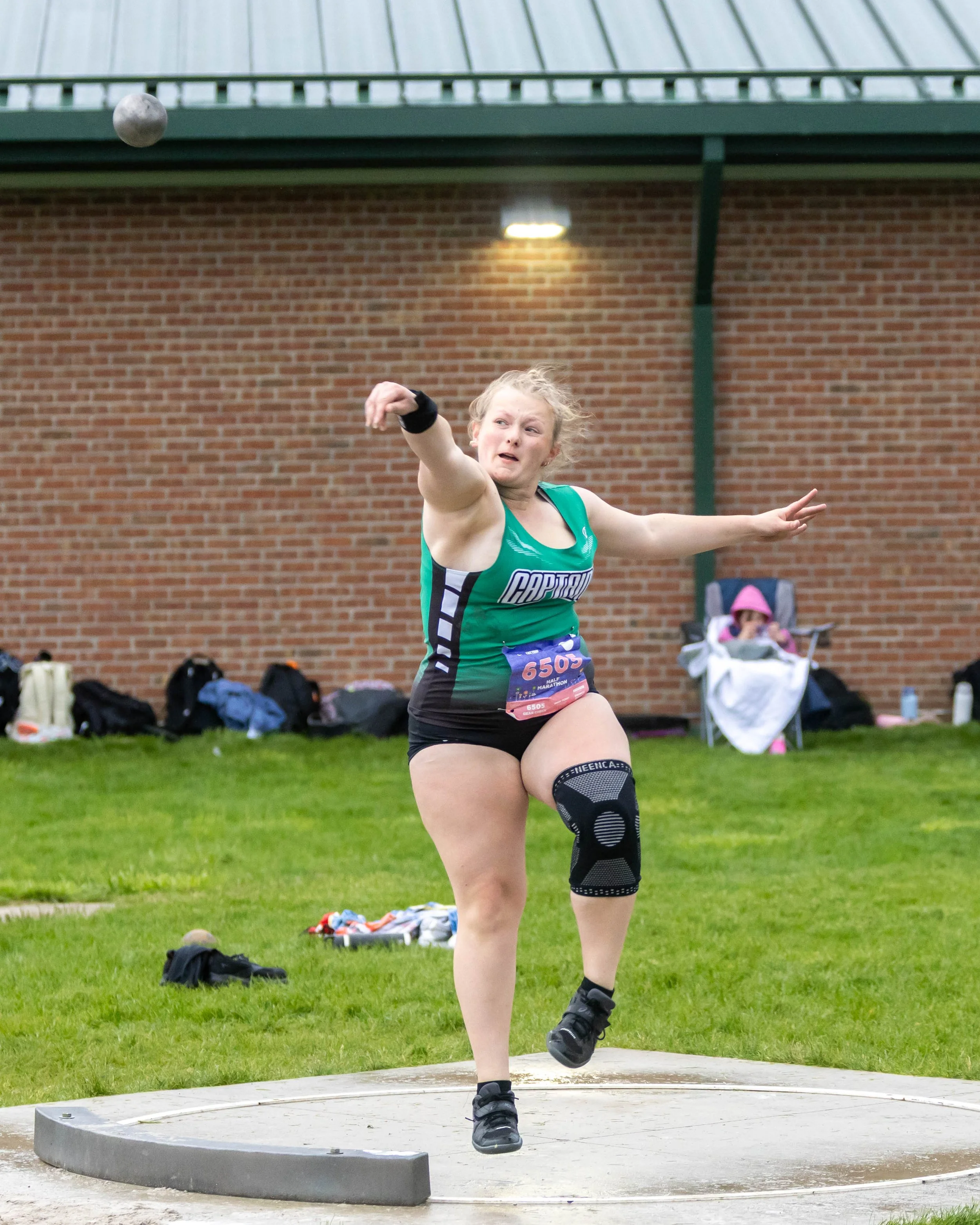 Kettering #6505 throws the shot put