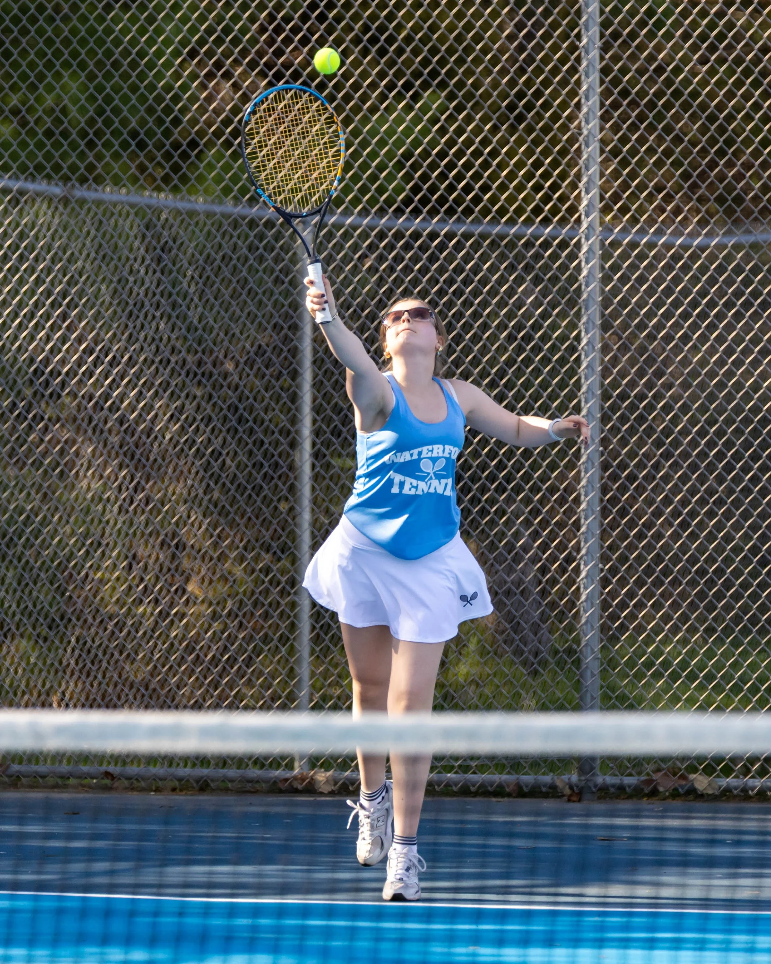 Waterford United player serves the ball