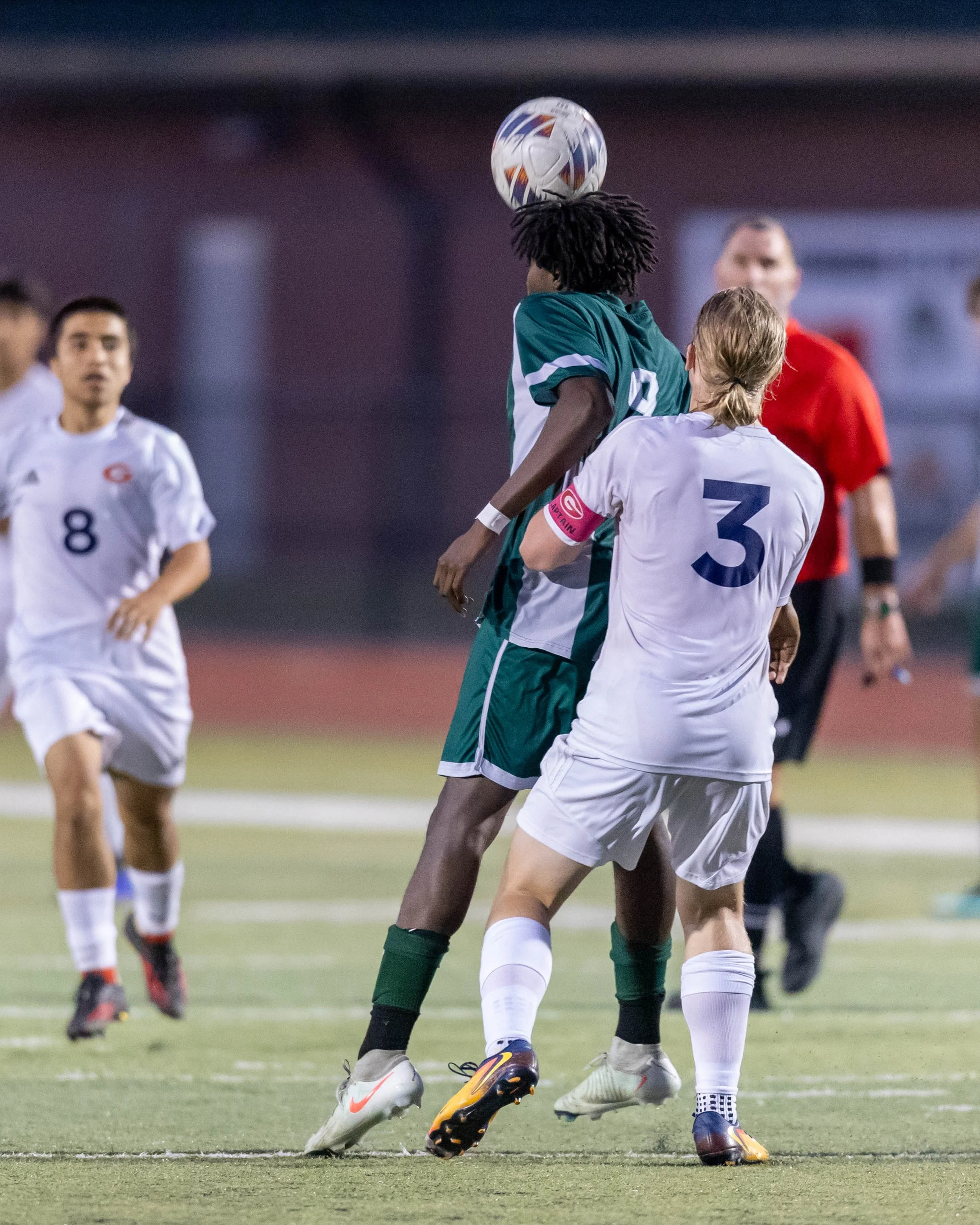 WK 9 heads the ball