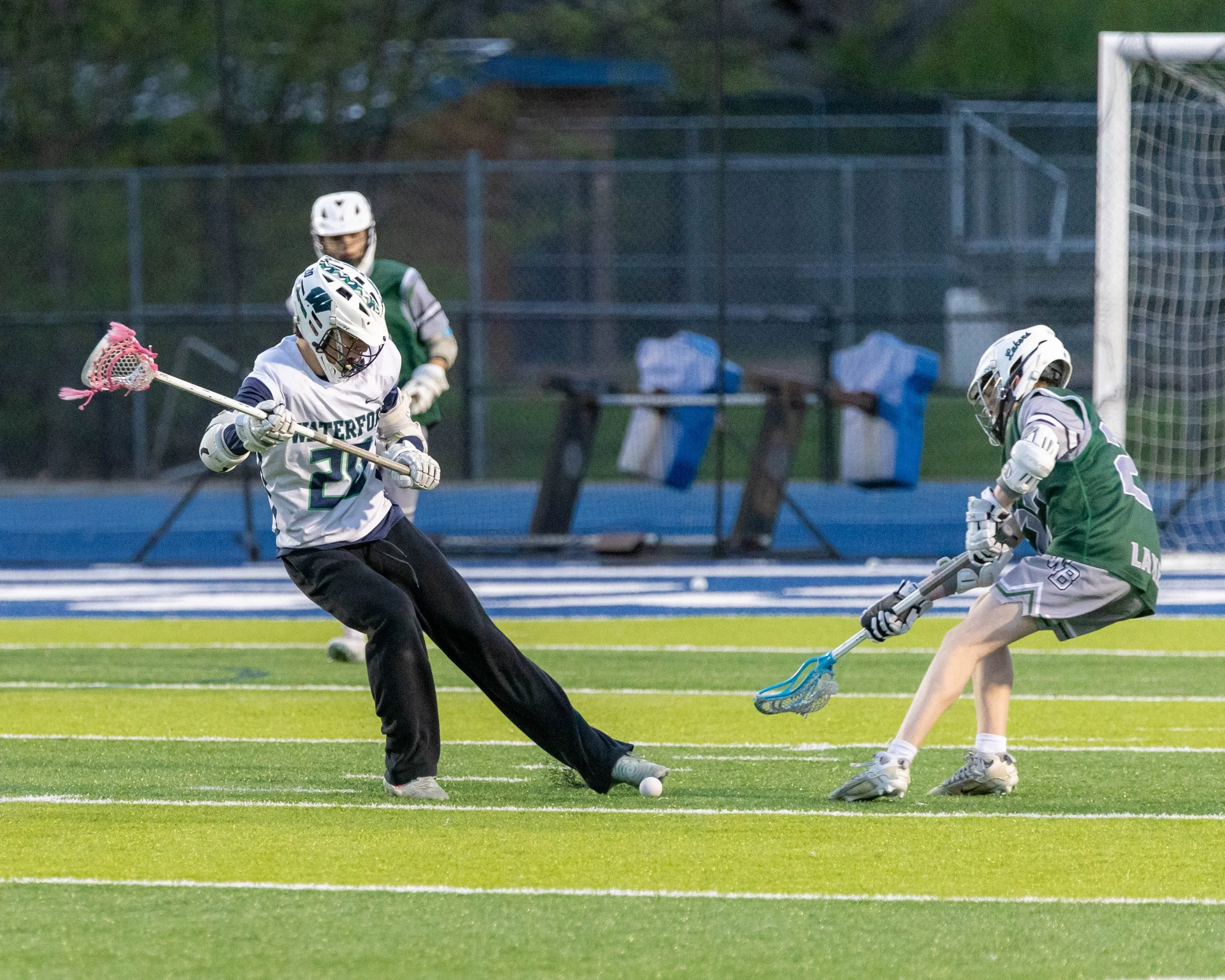#20 kicks the ball