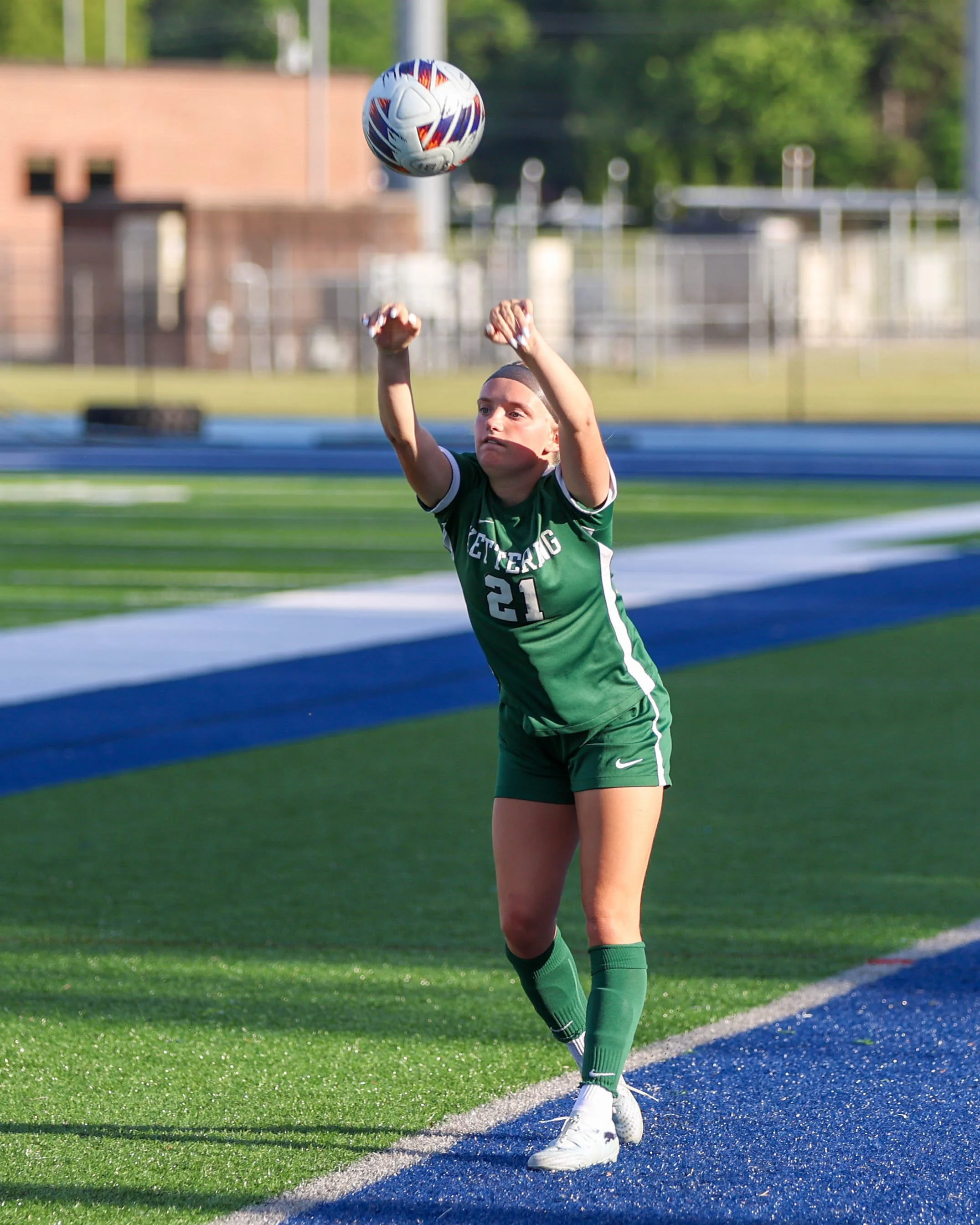 #21 inbounds the ball