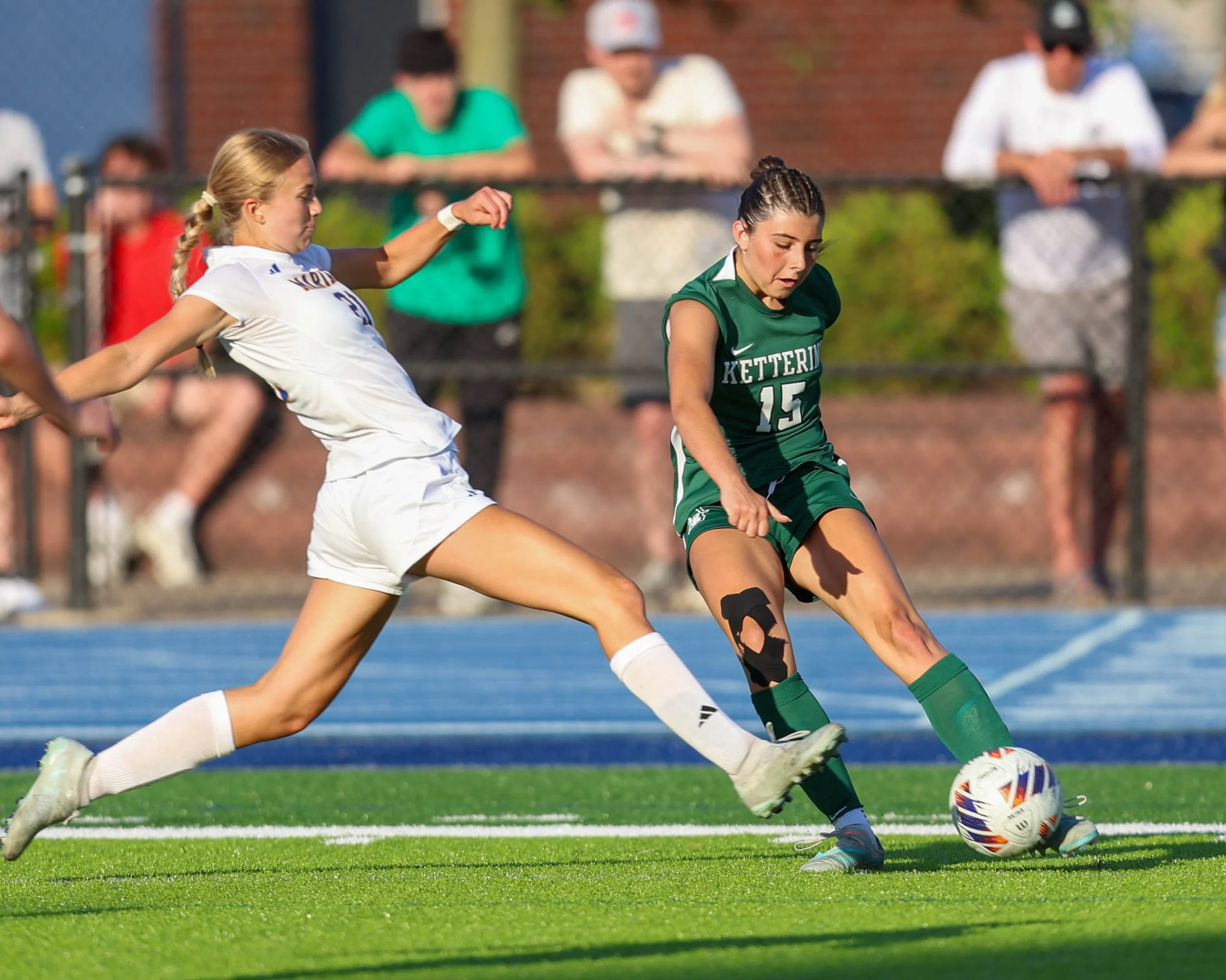 #15 kicks the ball