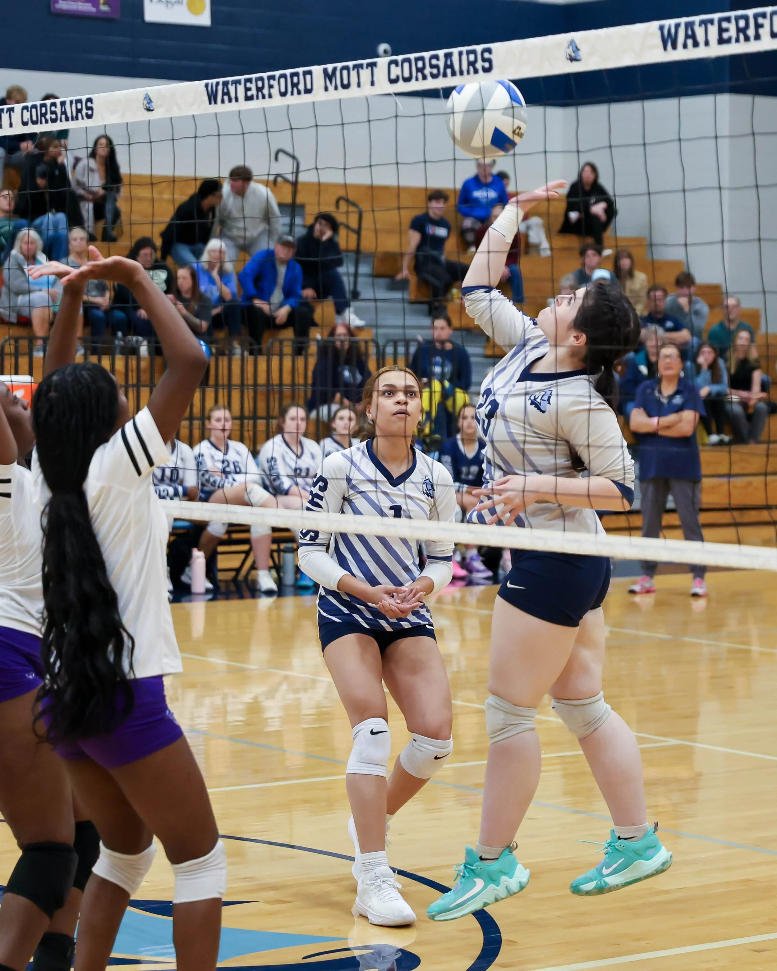 Mott #23 returns the ball