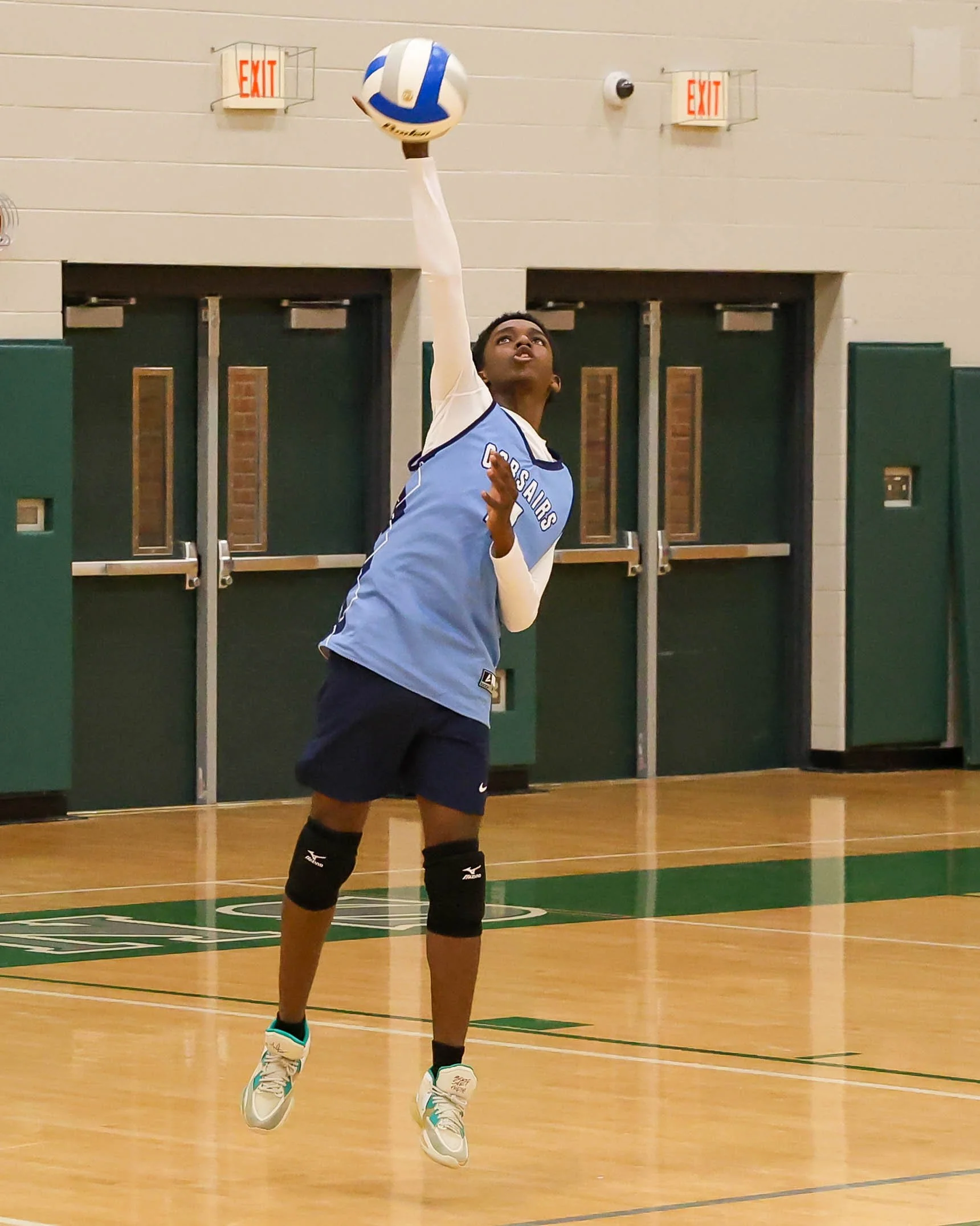 Mott #4 serves the ball