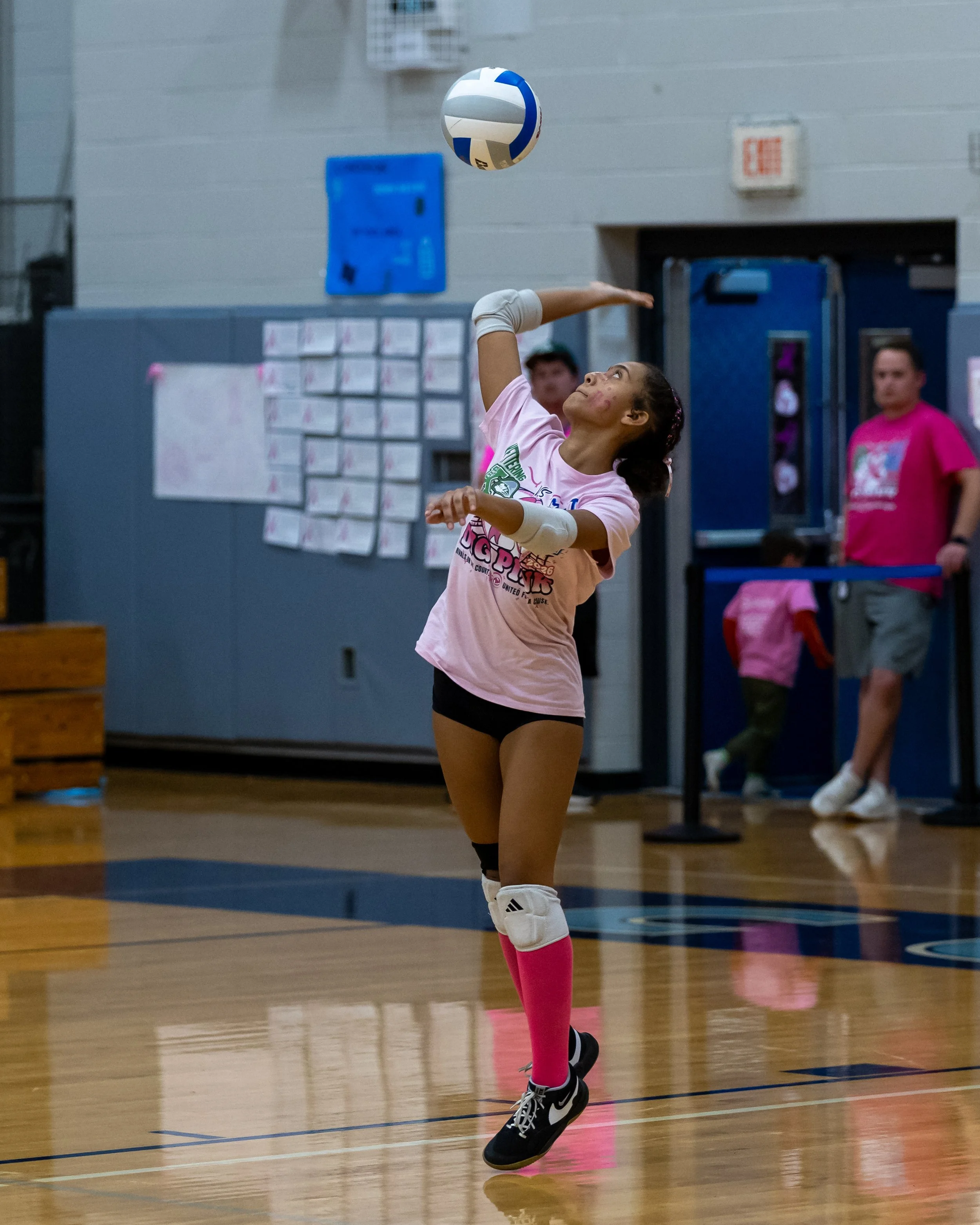 Mott player serves the ball