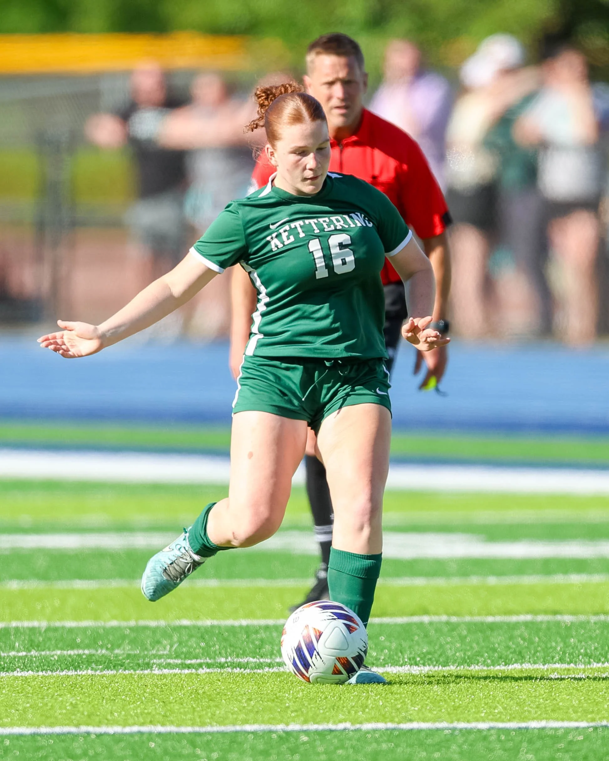#15 kicks the ball