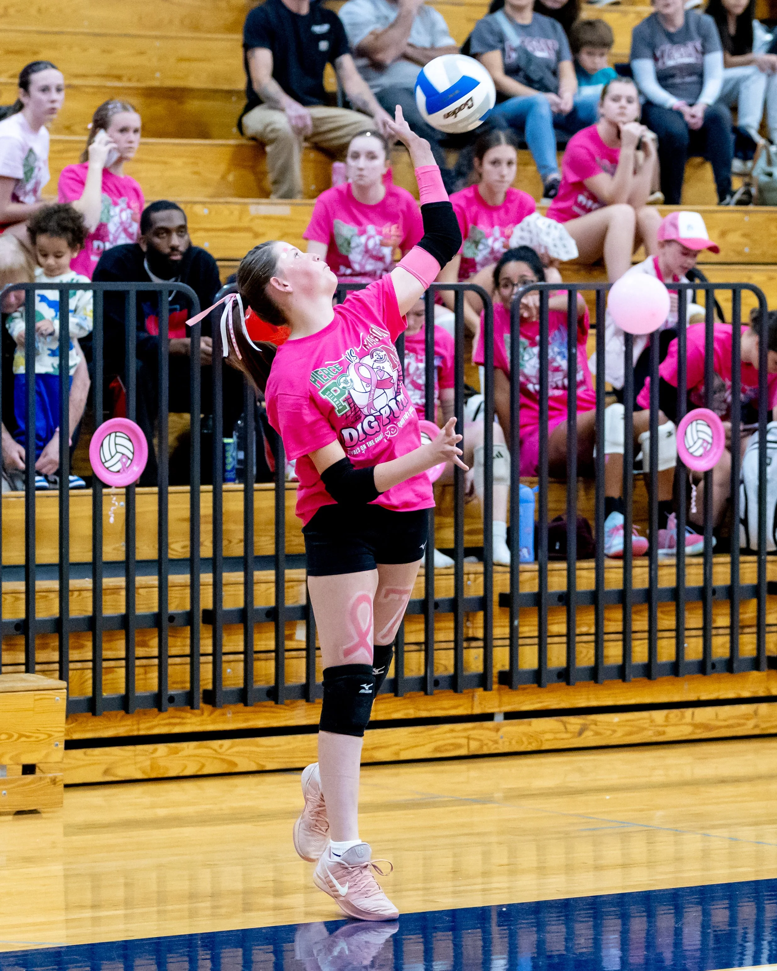 Pierce player serves the ball