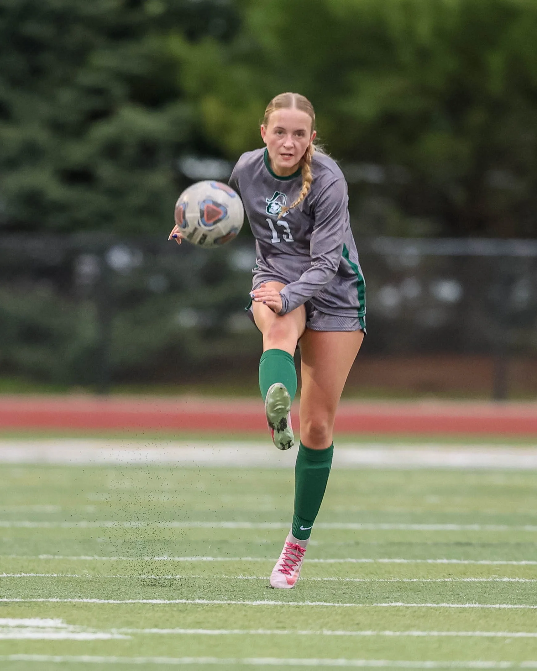 #13 kicks the ball