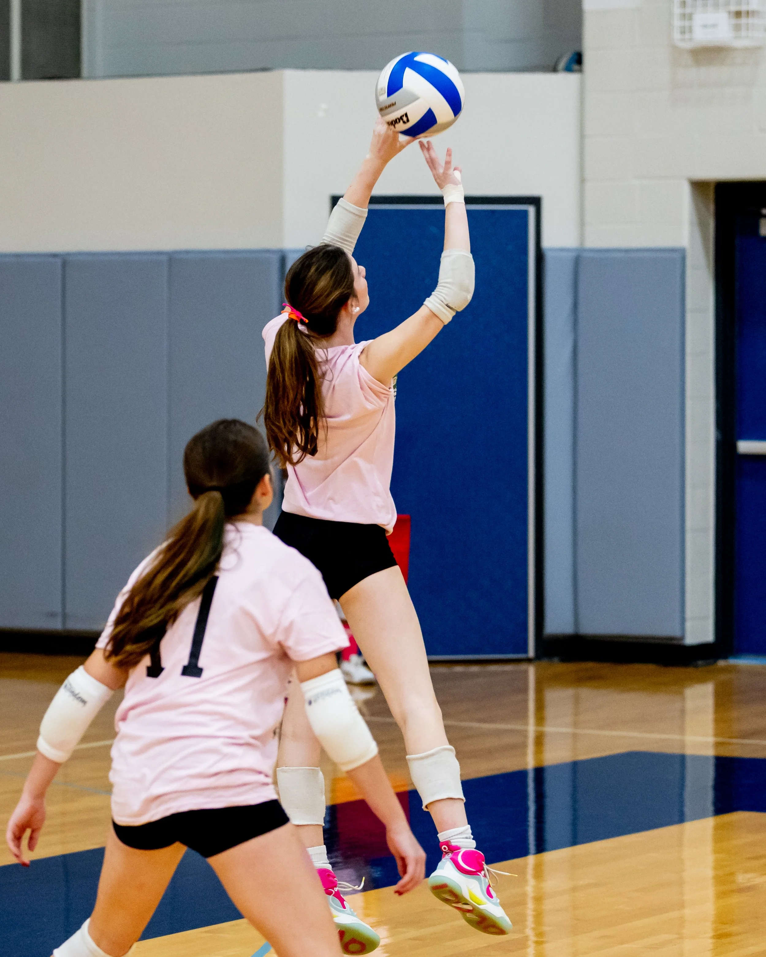 Mason player hits the ball