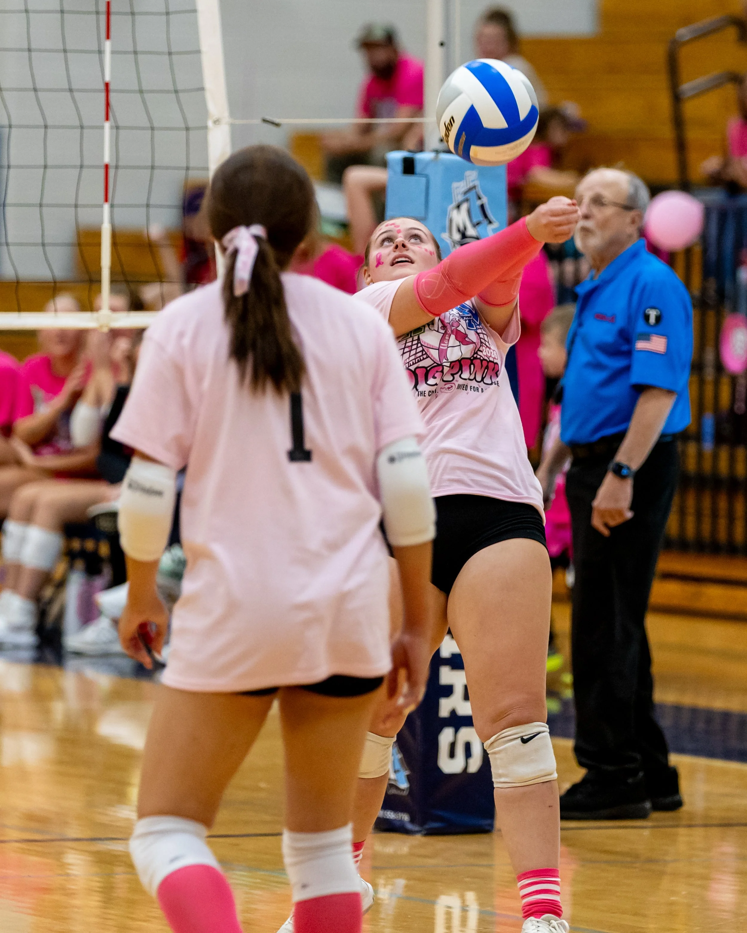 Moitt player hits the ball