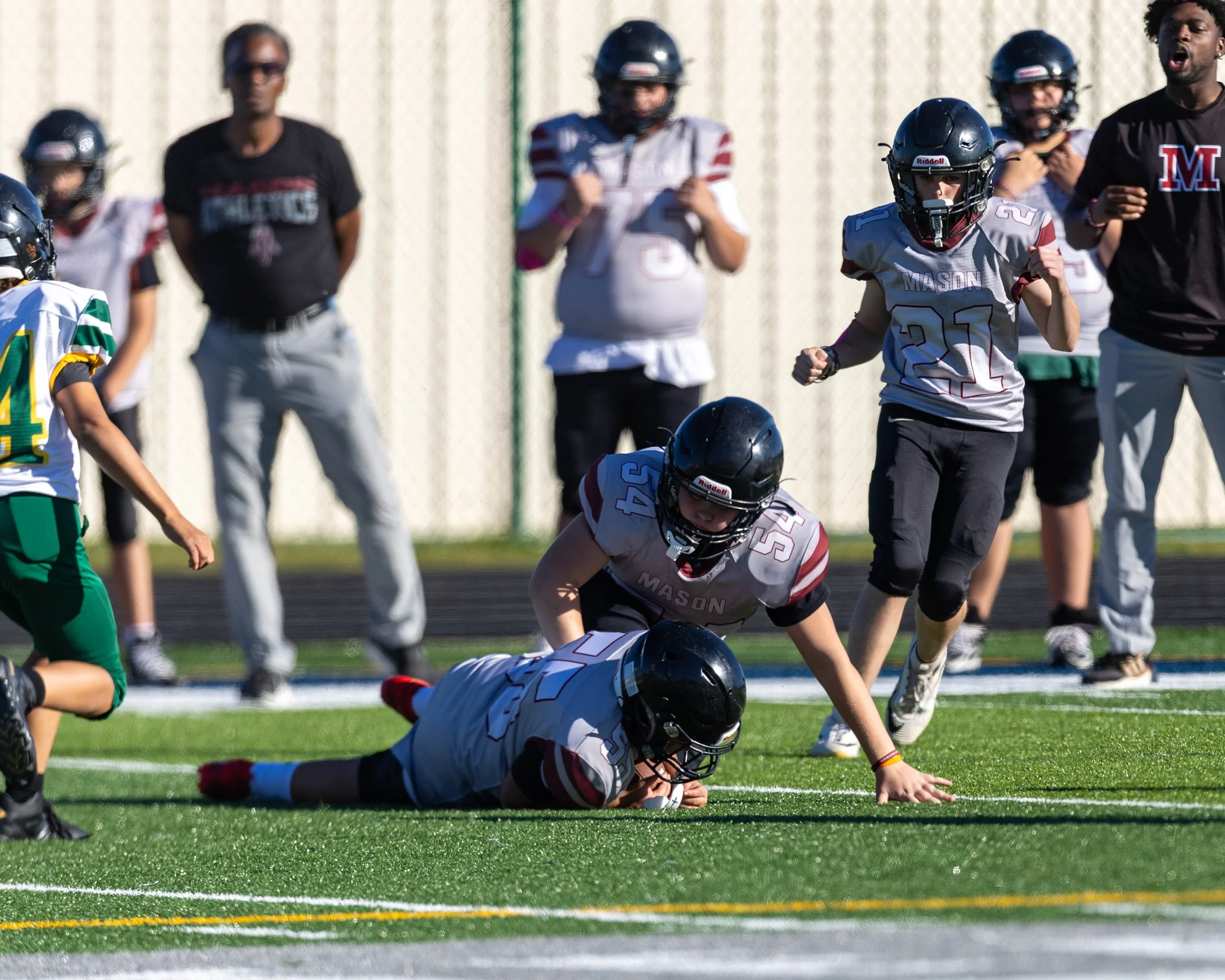 Mason #55 falls on the ball