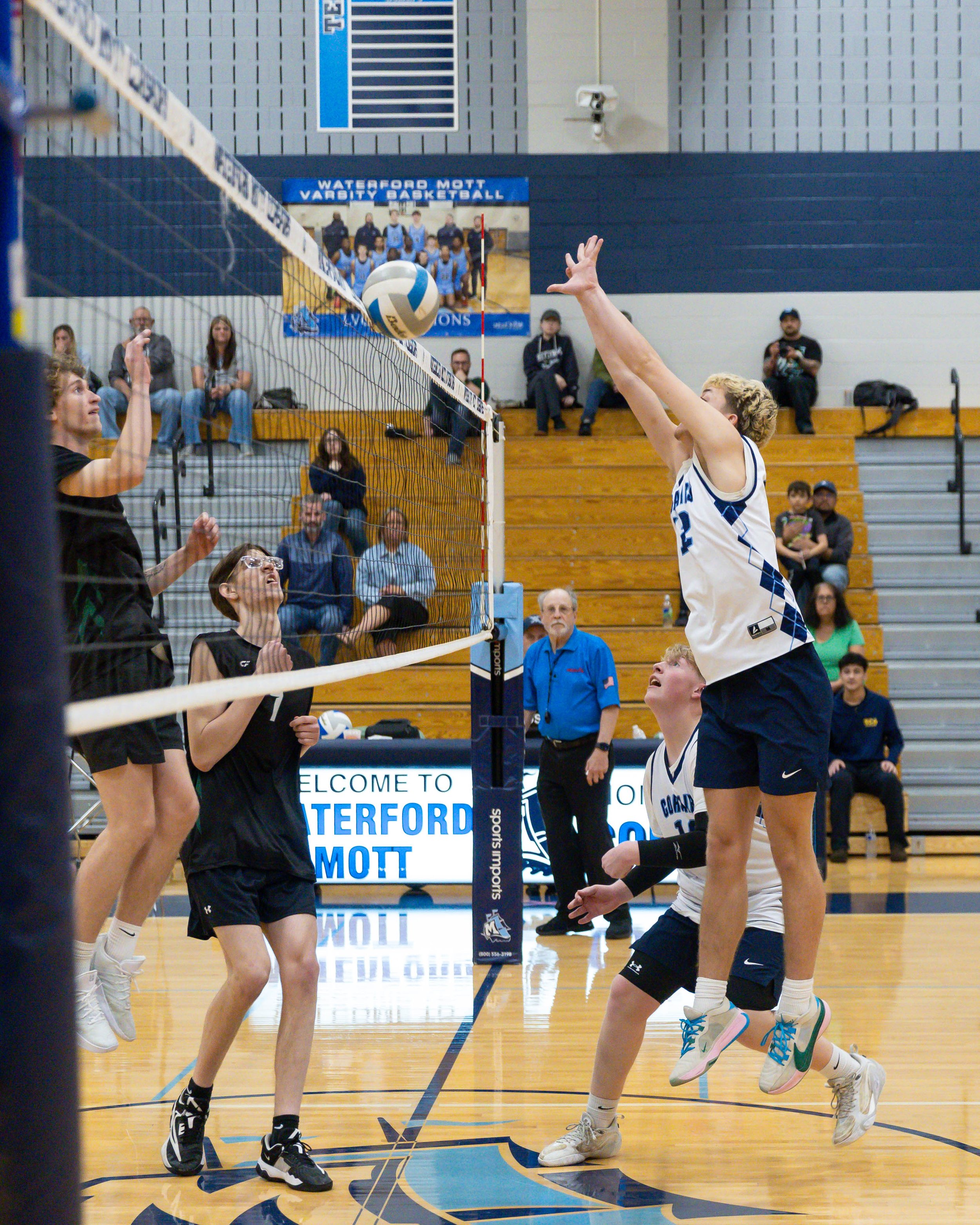 Mott #18 blocks the ball