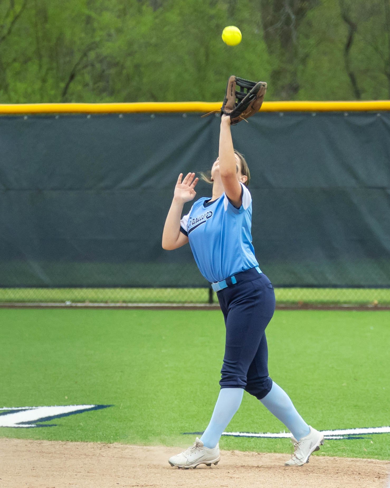 Mott short stop catches the ball