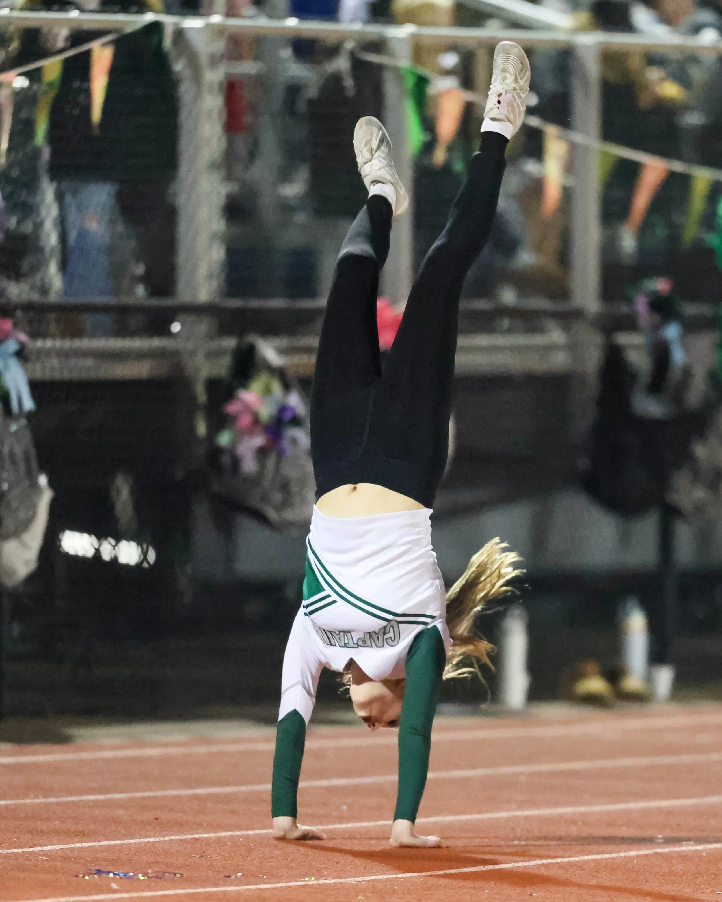 WK Cheerleader does a flip