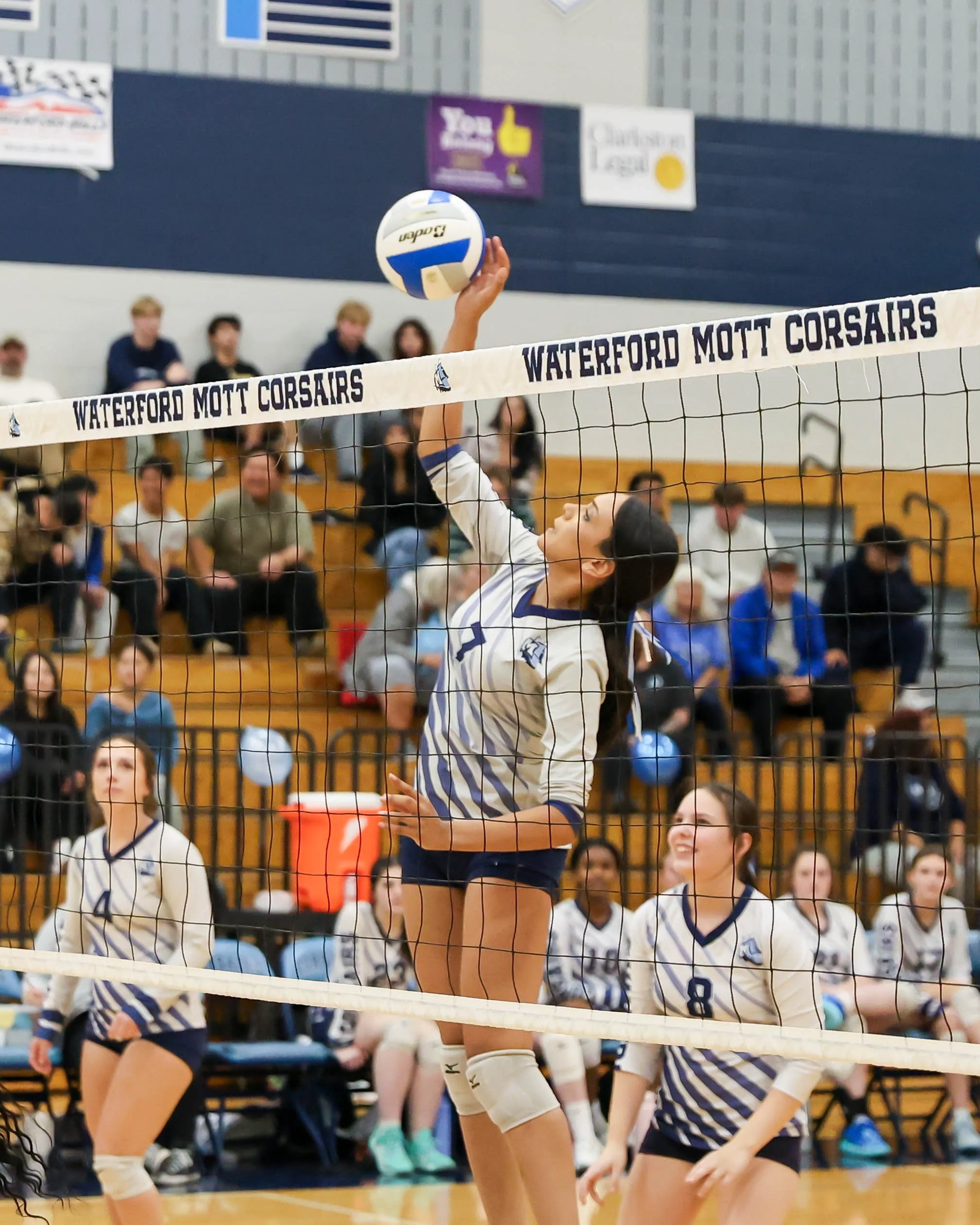 Mott #7 spikes the ball 