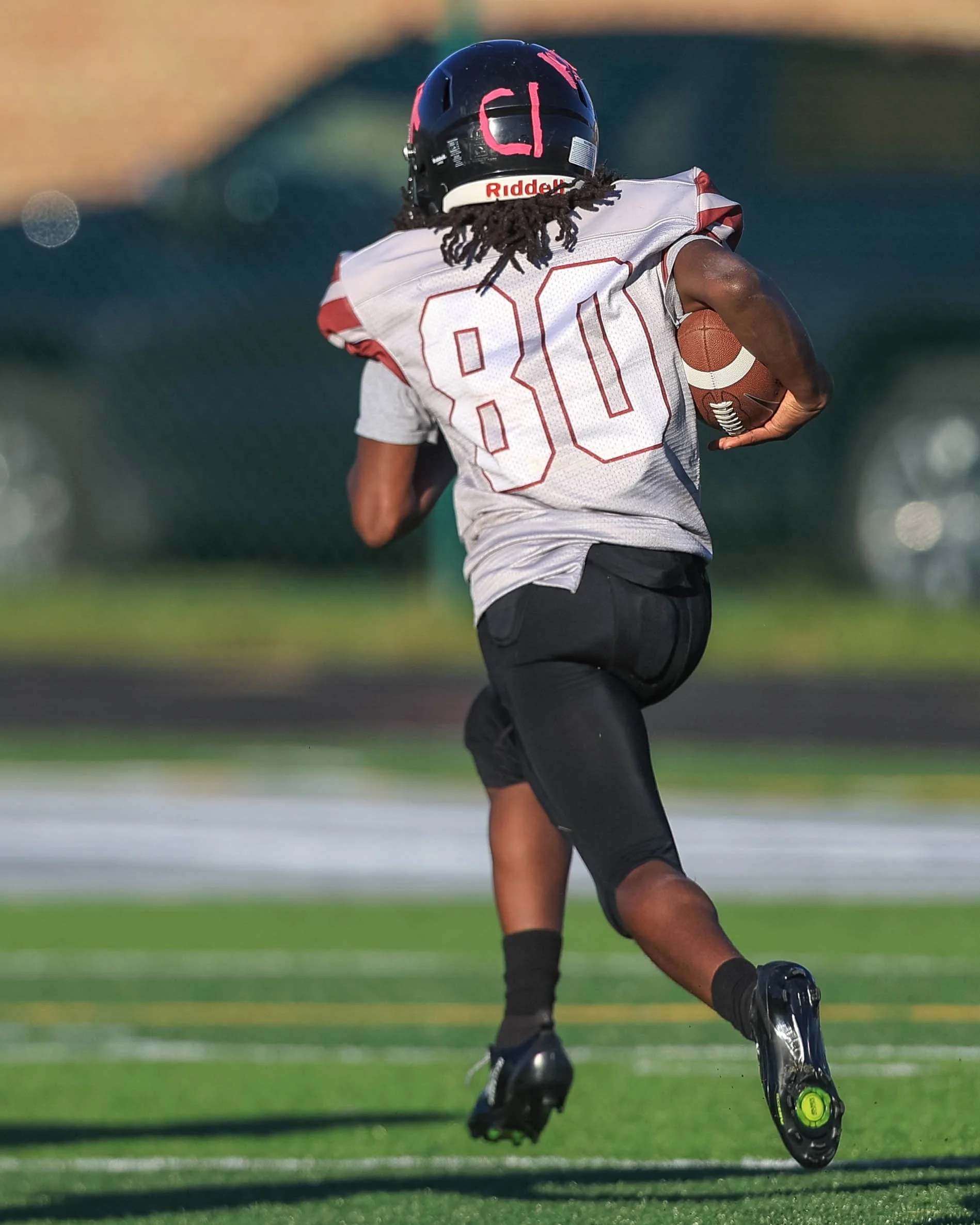Mason #80 runs towards the end zone
