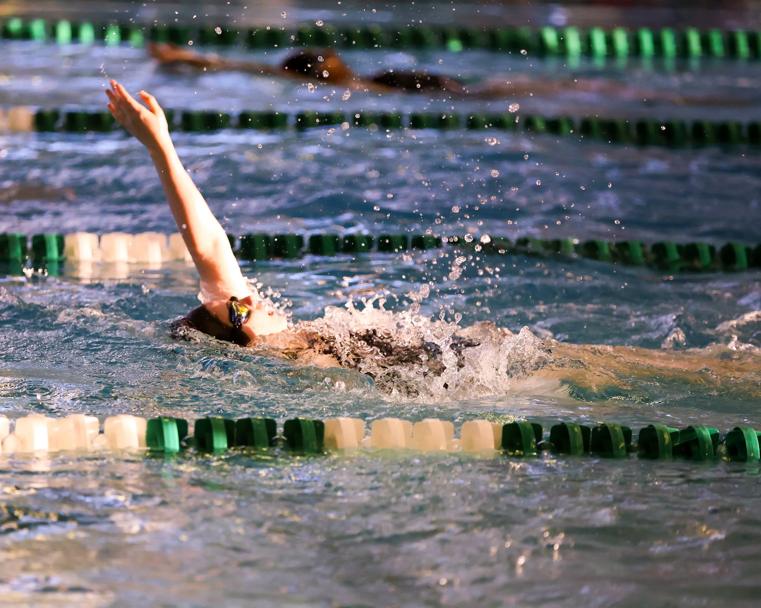 WU swimmer doing the backstroke